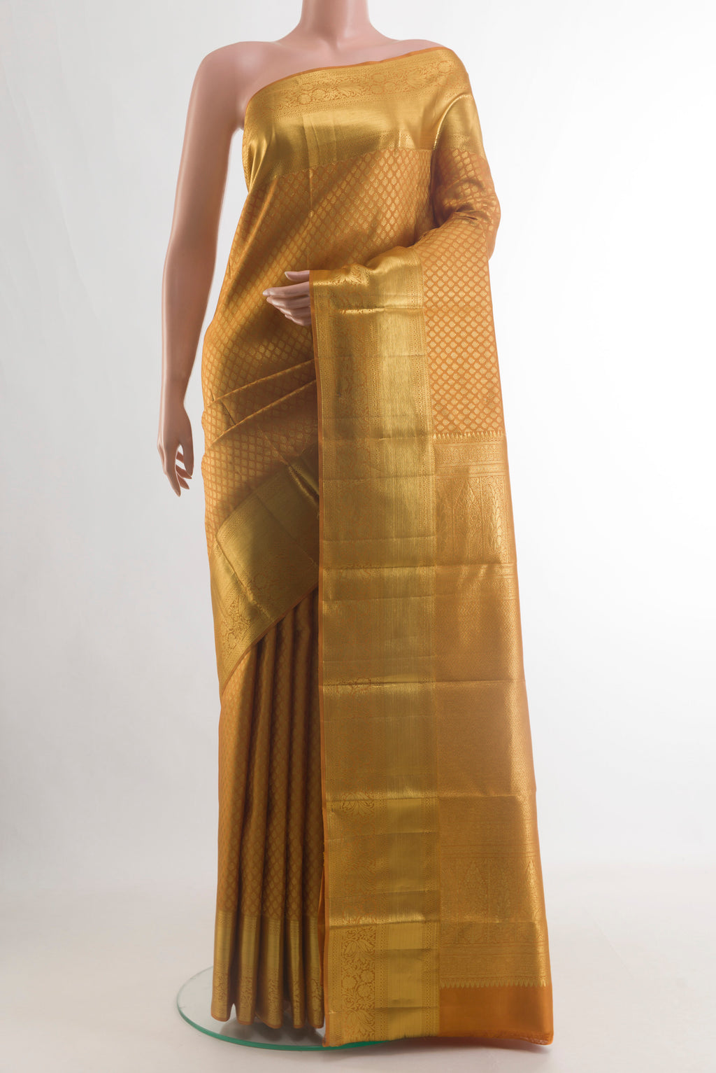 Pure Silk Mustard Kanchipuram Saree with Zari Brocade on the body and Zari Border.  displayed on a mannequin