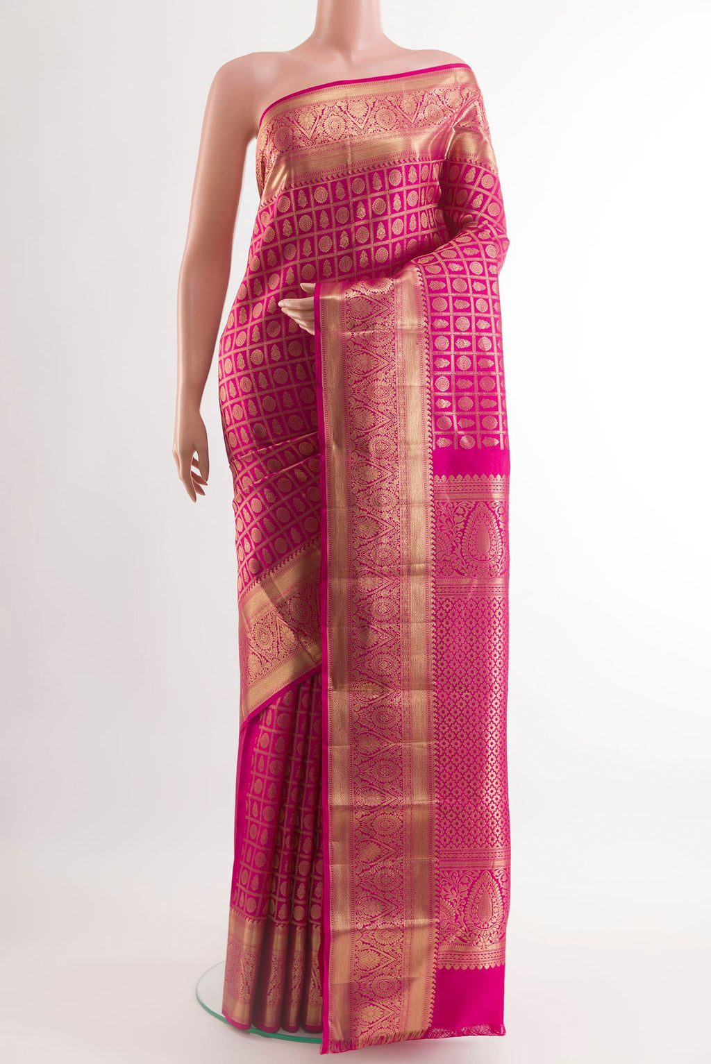 Pink Kanchipuram Silk Saree with Zari Brocade on the body and Zari Border.  displayed on a mannequin