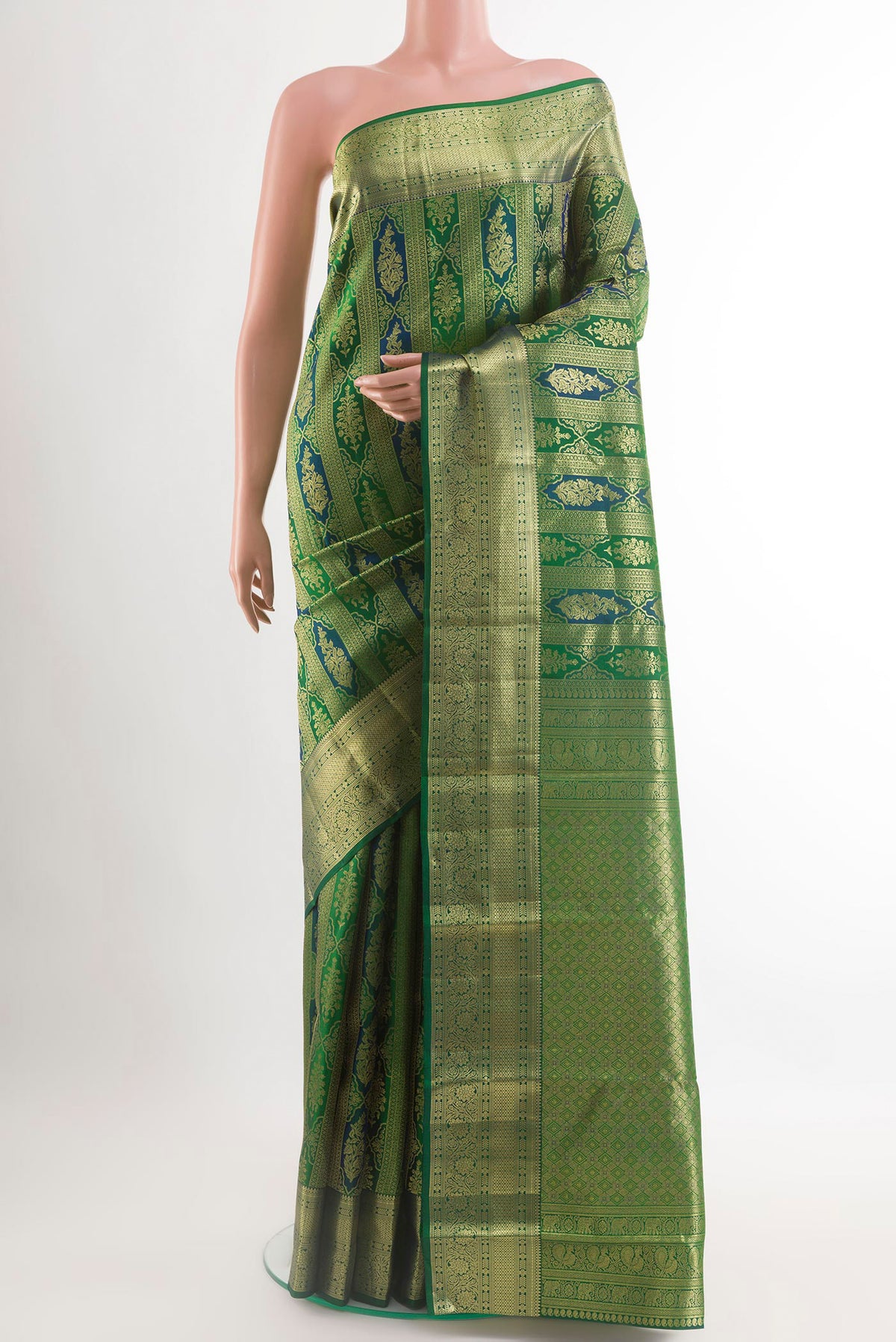 Green Kanchipuram Silk Saree with Zari Brocade on the body and Zari Border.  displayed on a mannequin