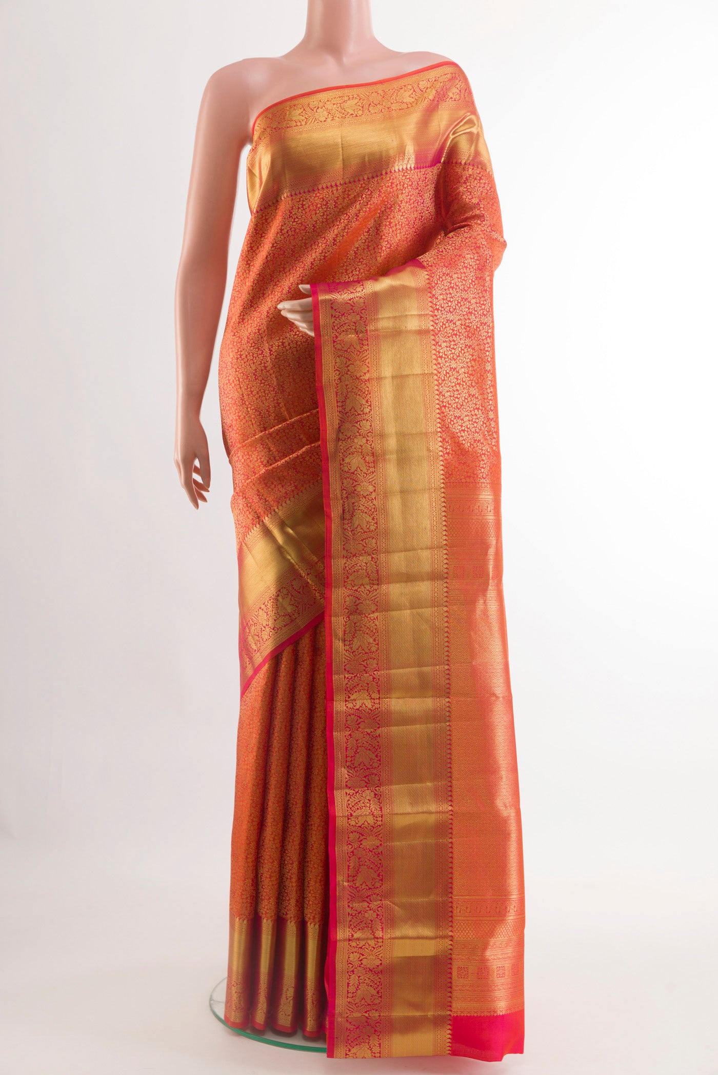 Red Kanchipuram Silk Saree with Zari Brocade on the body and Zari Border.  displayed on a mannequin