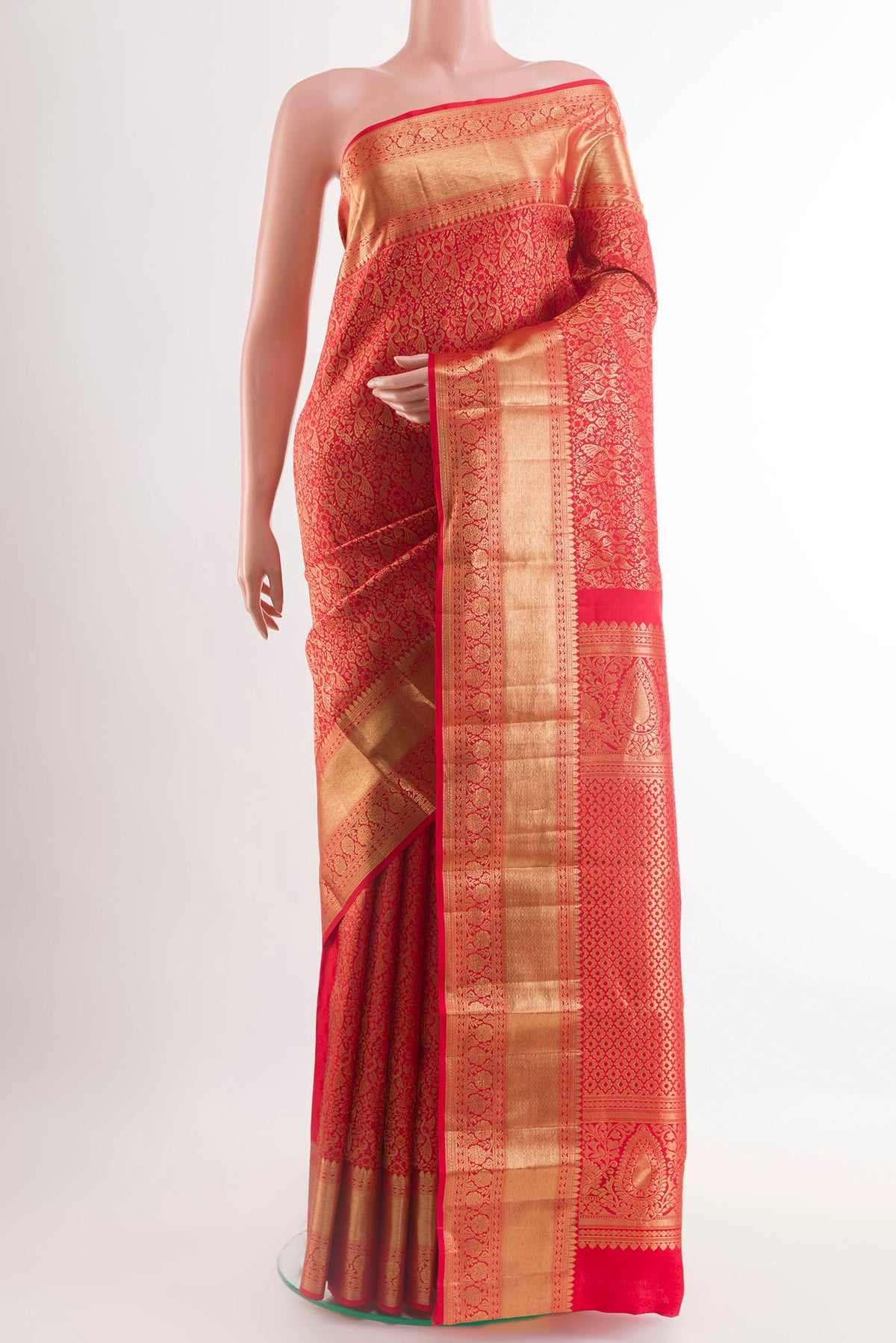 Red Kanchipuram Silk Saree with Zari Brocade on the body and Zari Border.  displayed on a mannequin