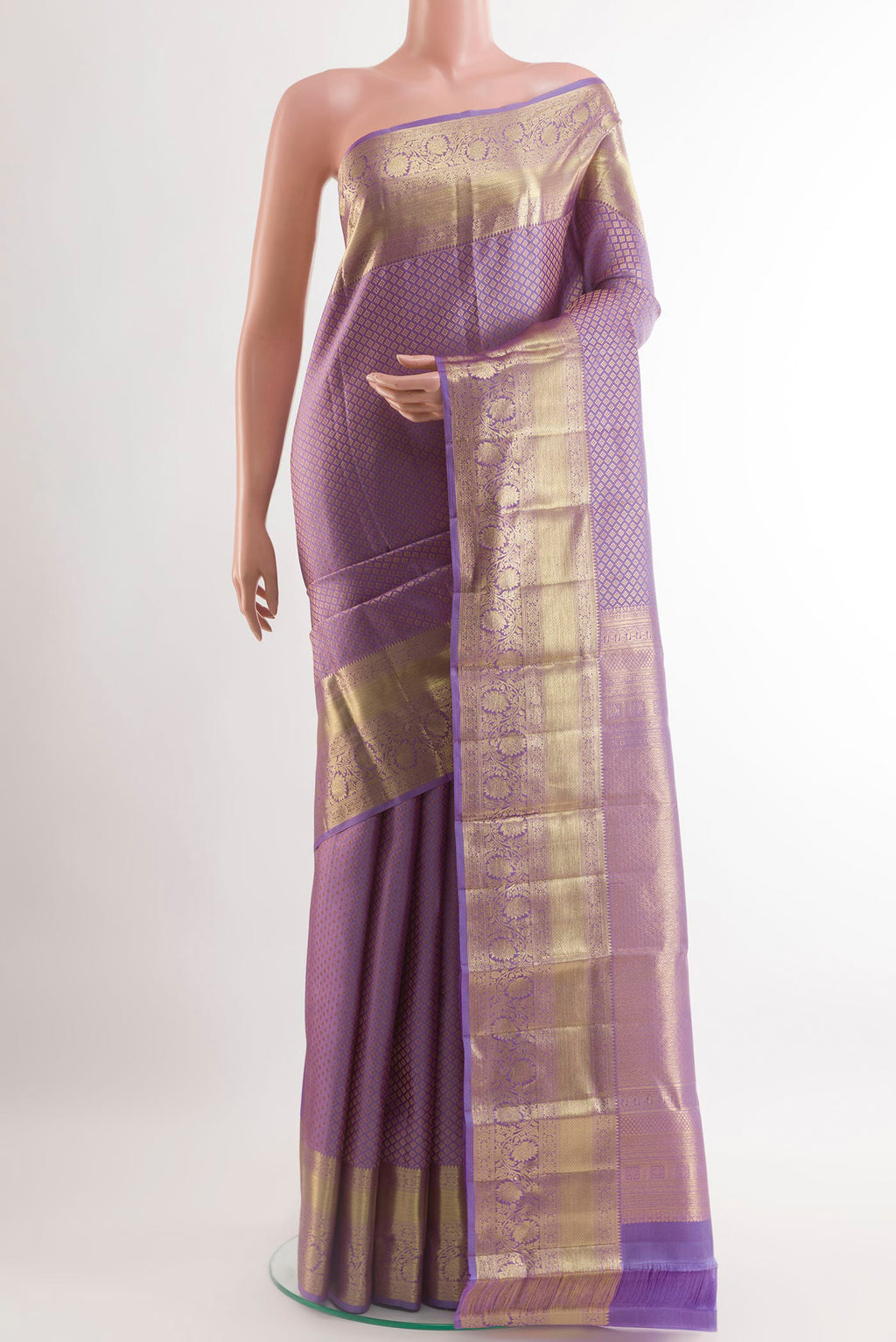 Lavender Kanchipuram Silk Saree with Zari Brocade on the body and Zari Border.  displayed on a mannequin