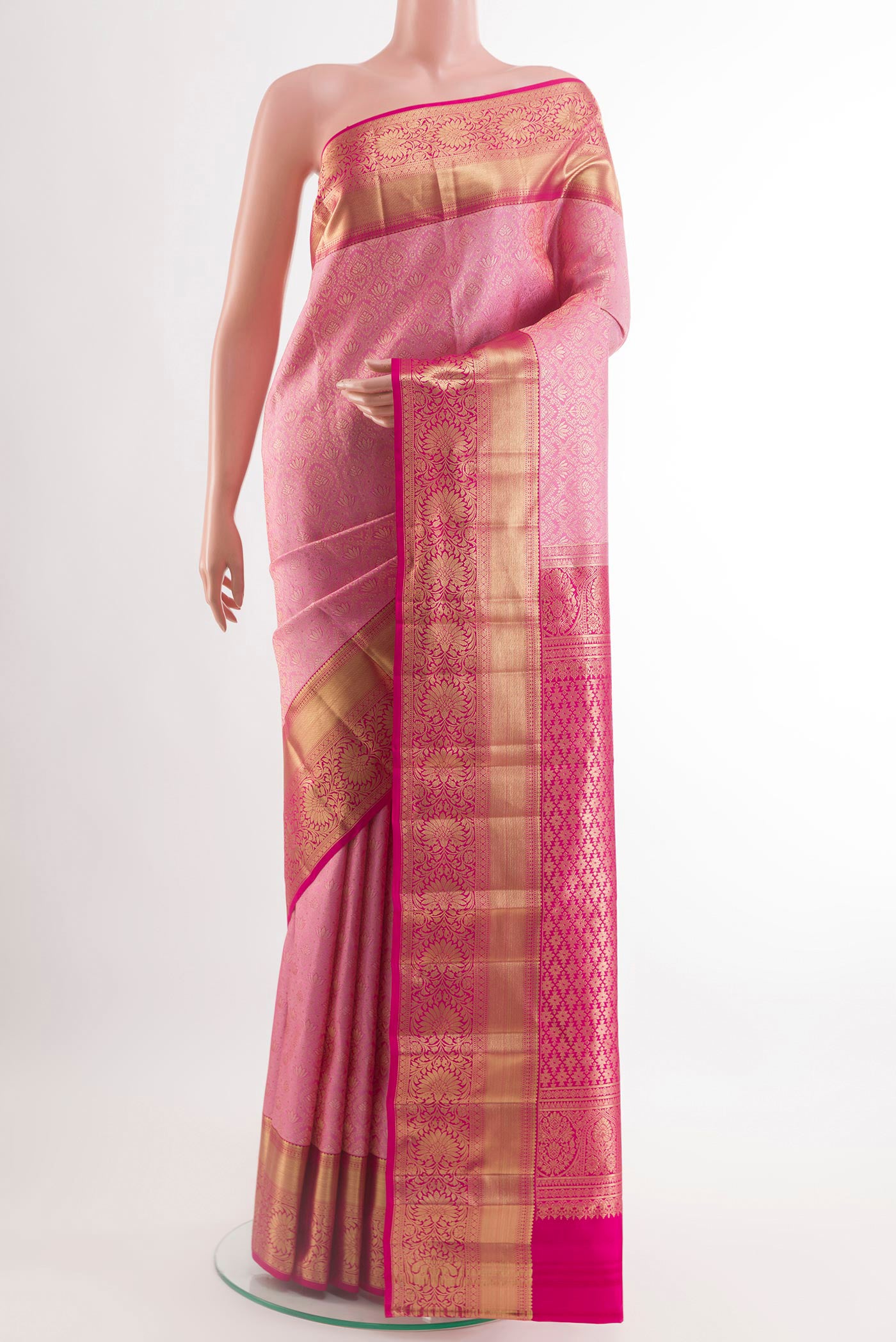 Pink Kanchipuram Silk Saree with Zari Brocade on the body and Zari Border.  displayed on a mannequin