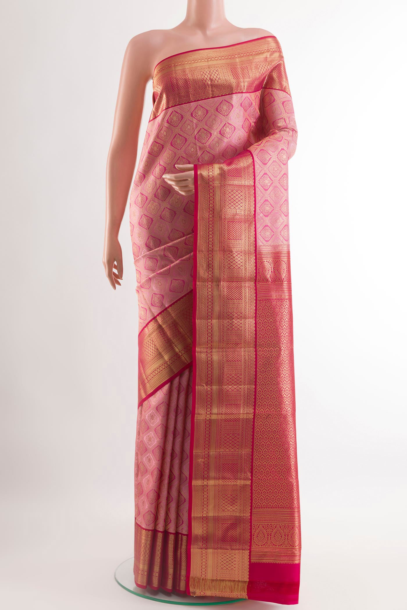 Pink Kanchipuram Silk Saree with Zari Brocade on the body and Zari Border.  displayed on a mannequin