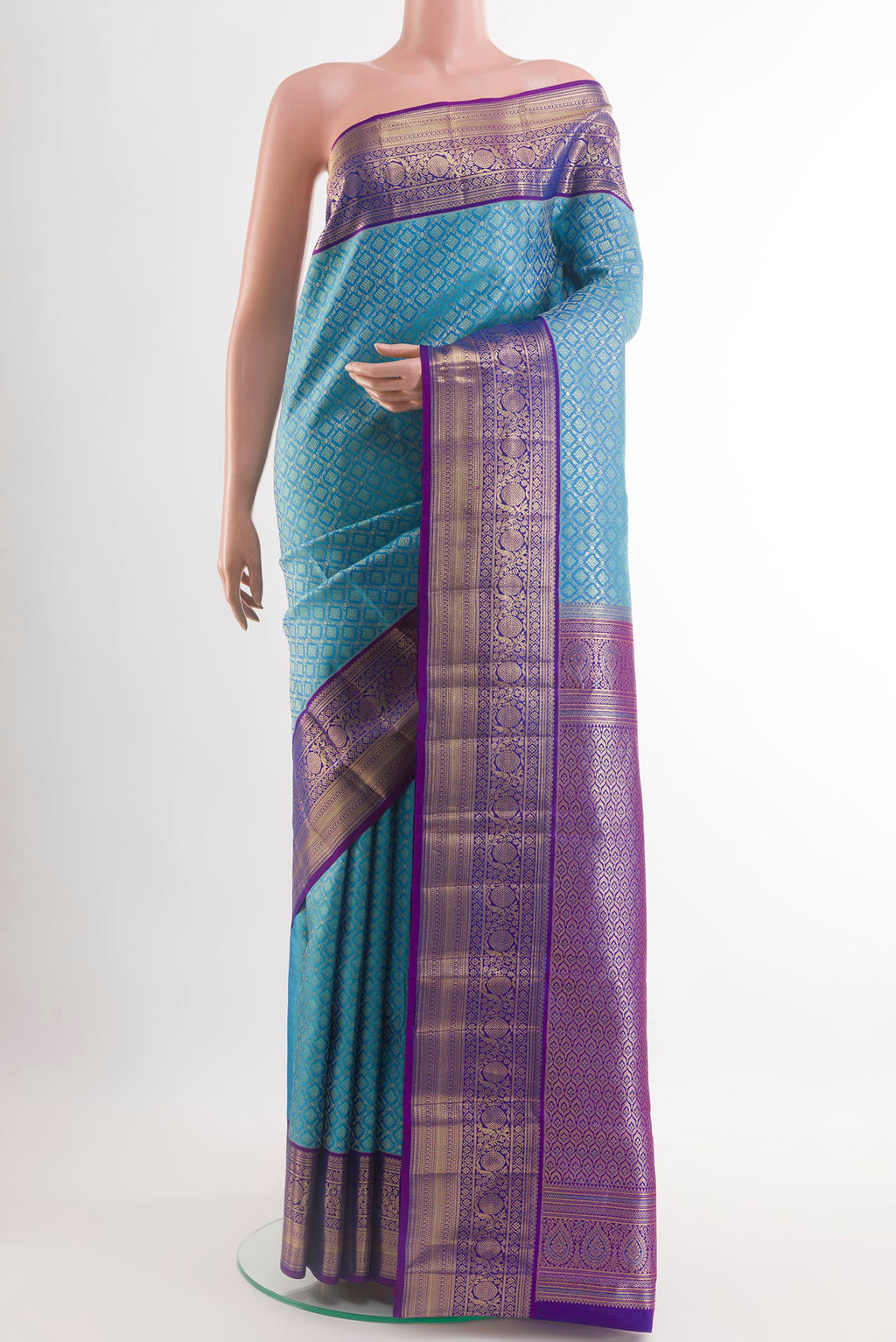 Blue Kanchipuram Silk Saree with Zari Brocade on the body and Zari Border.  displayed on a mannequin