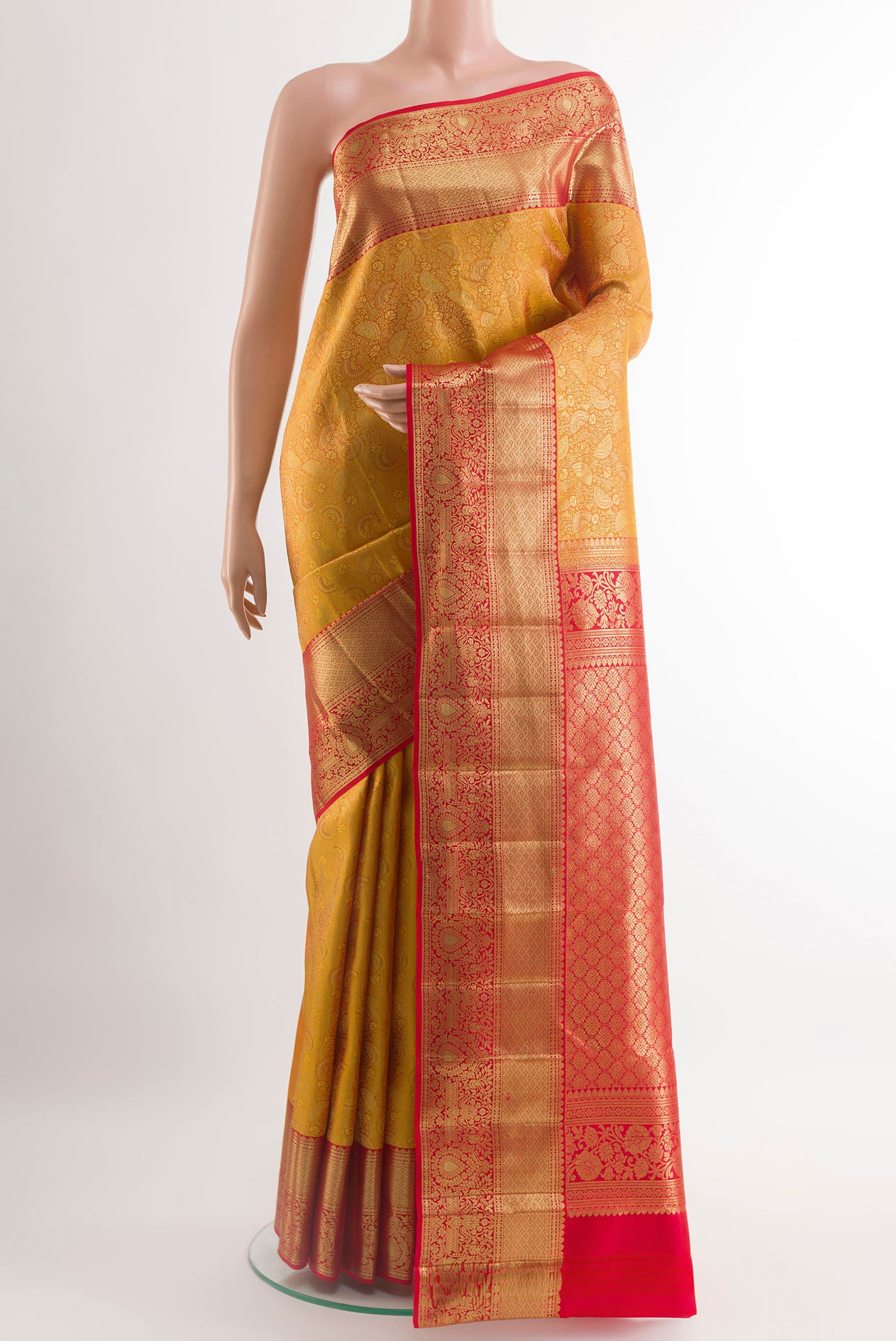 Yellow Kanchipuram Silk Saree with Jacquard design on the body and Zari Border.  displayed on a mannequin
