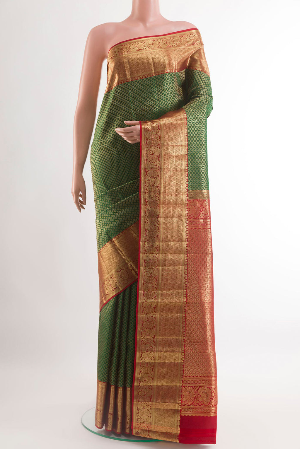 Green Kanchipuram Silk Saree with Zari Brocade on the body and Zari Border.  displayed on a mannequin
