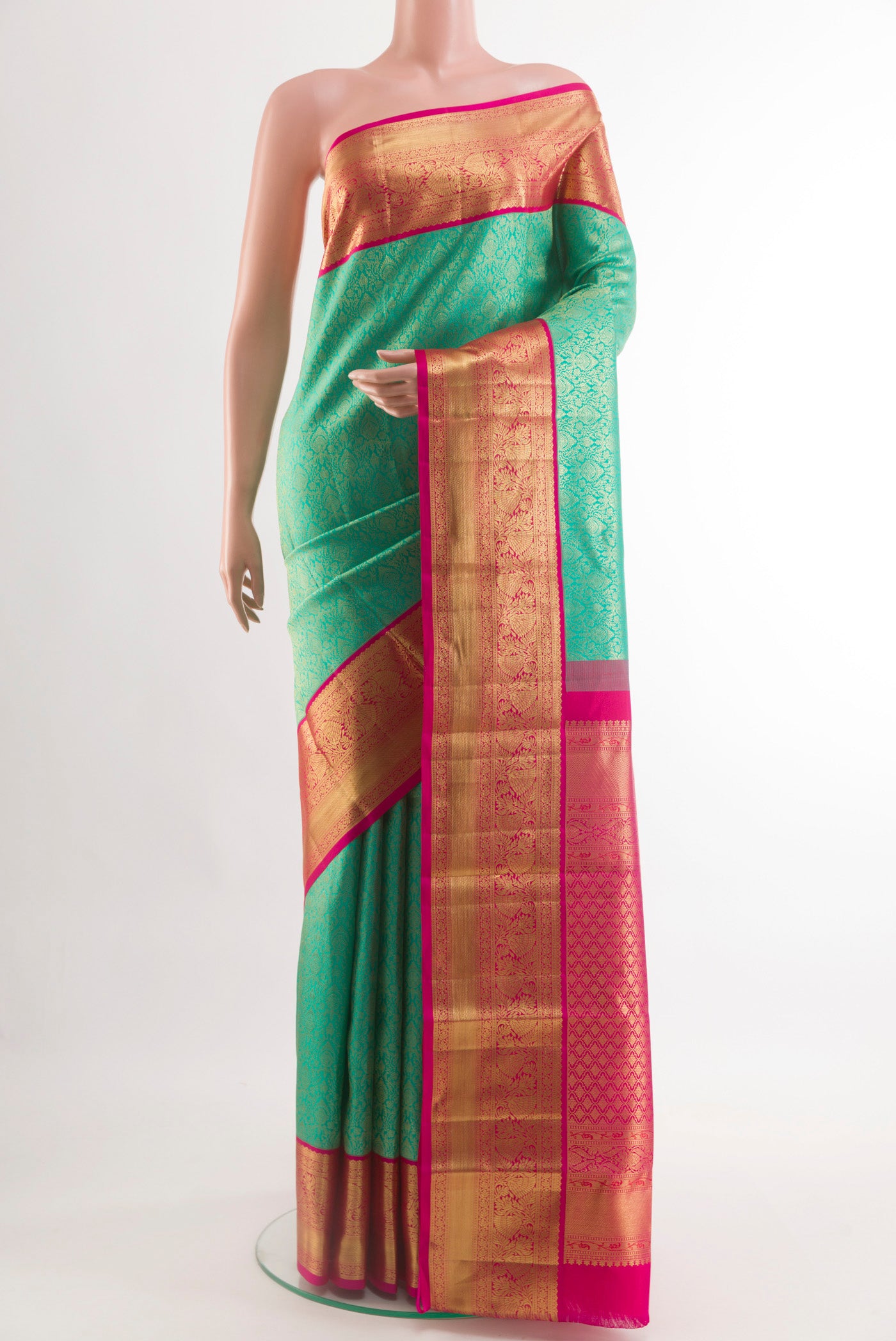 Sea Green Kanchipuram Silk Saree with Zari Brocade on the body and Zari Border.  displayed on a mannequin