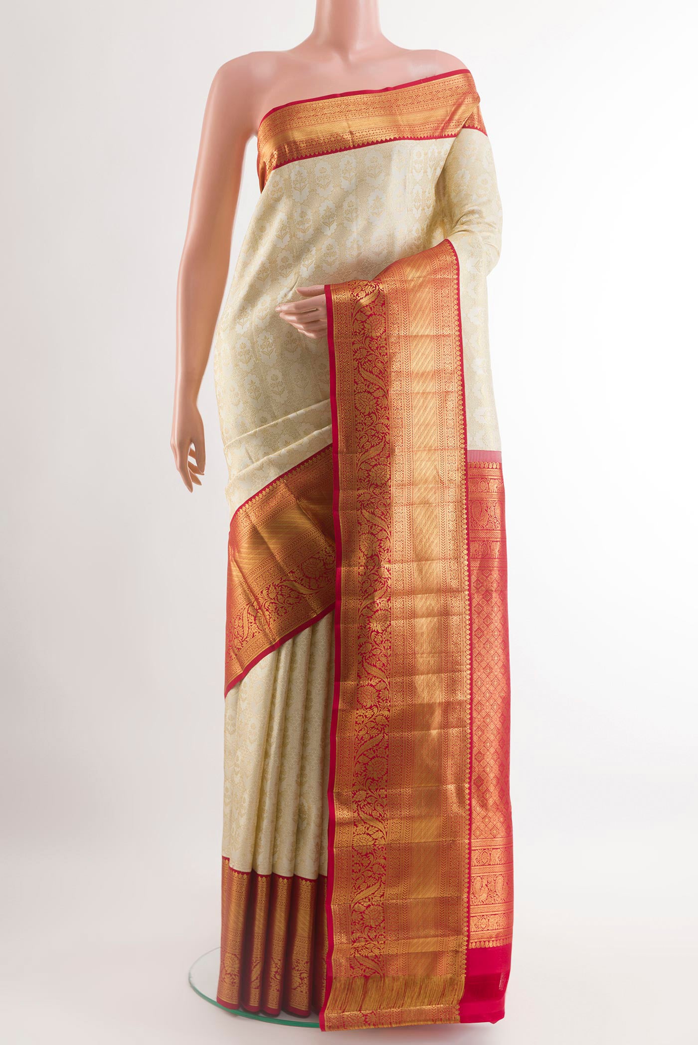Off White Kanchipuram Silk Saree with Zari Brocade on the body and Zari Border.  displayed on a mannequin