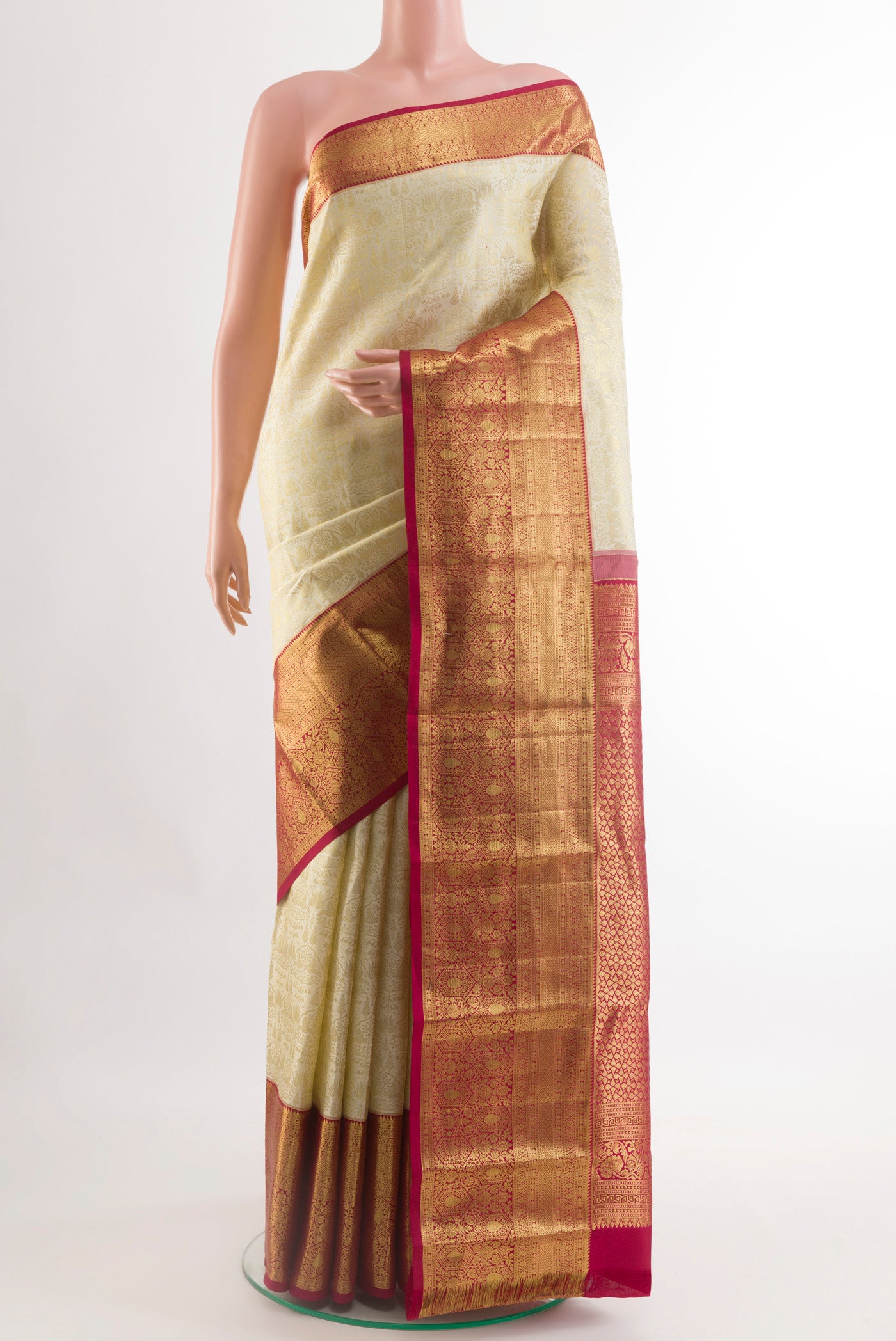Off White Kanchipuram Silk Saree with Zari Brocade on the body and Zari Border.  displayed on a mannequin
