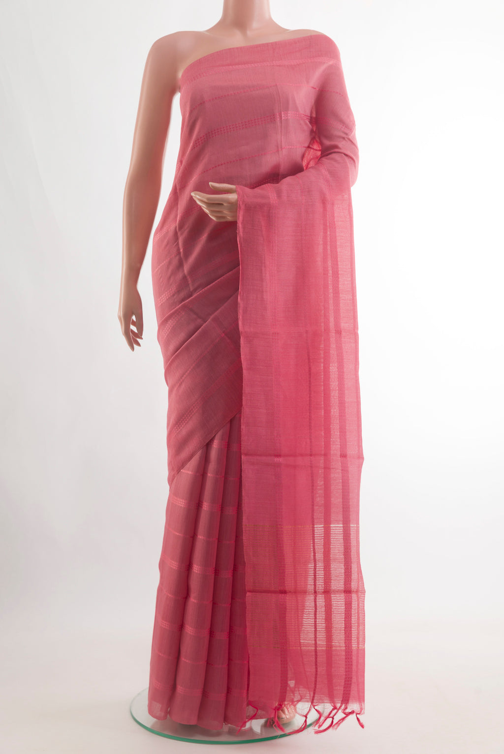 Pink Tussar Silk Saree with Stripes on the body and Plain Border.  displayed on a mannequin