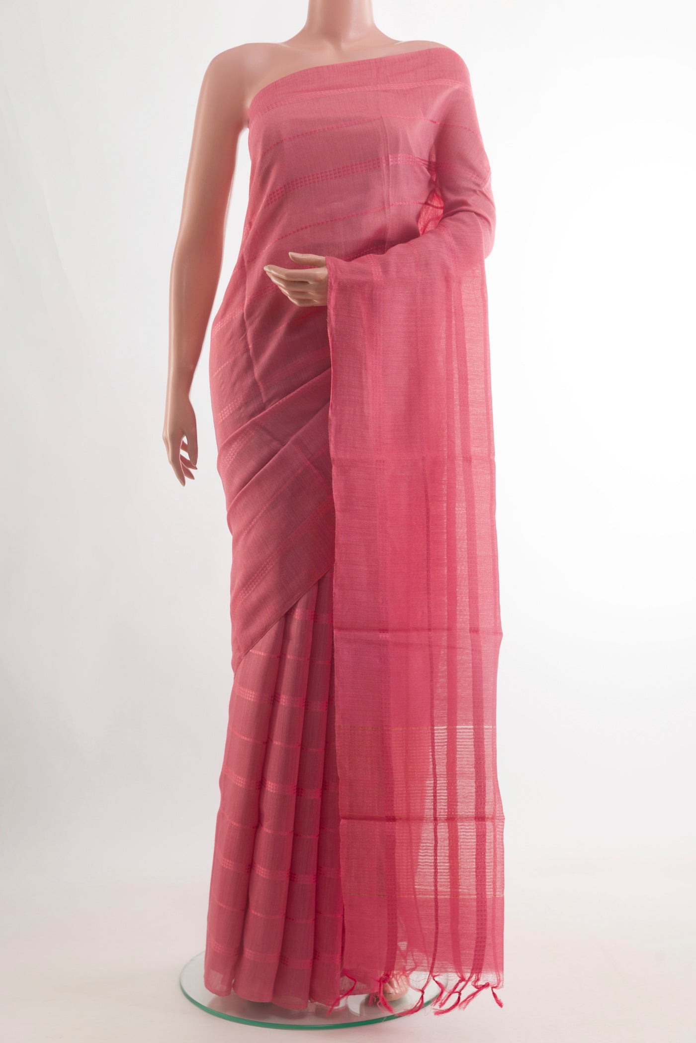 Pink Tussar Silk Saree with Stripes on the body and Plain Border.  displayed on a mannequin