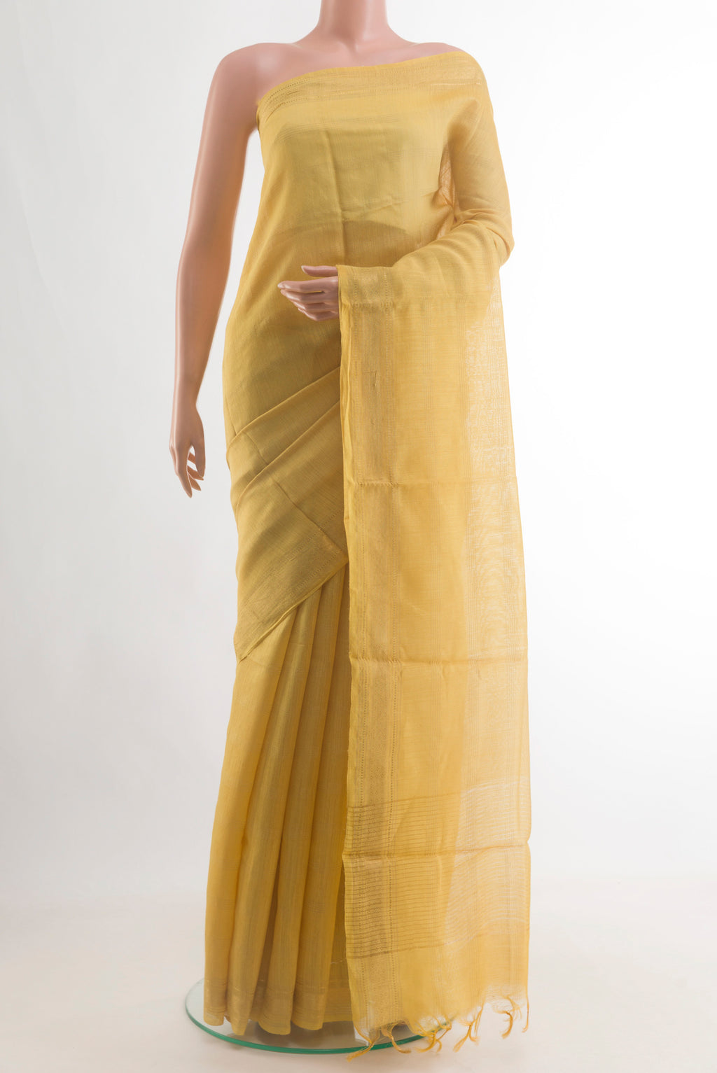 Yellow Tussar Saree with Stripes on the body and Zari Border.  displayed on a mannequin