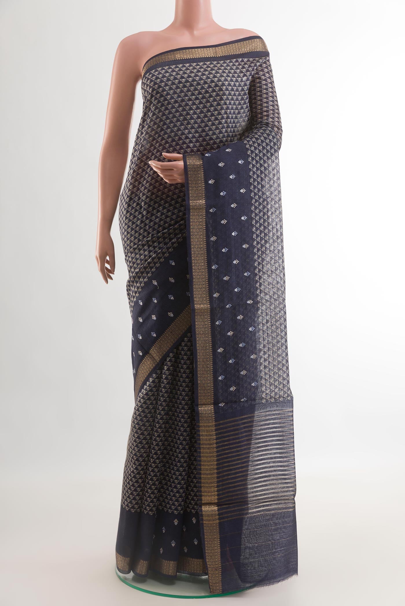 Navy Blue Tussar Silk Saree with Printed design on the body and Zari Border.  displayed on a mannequin