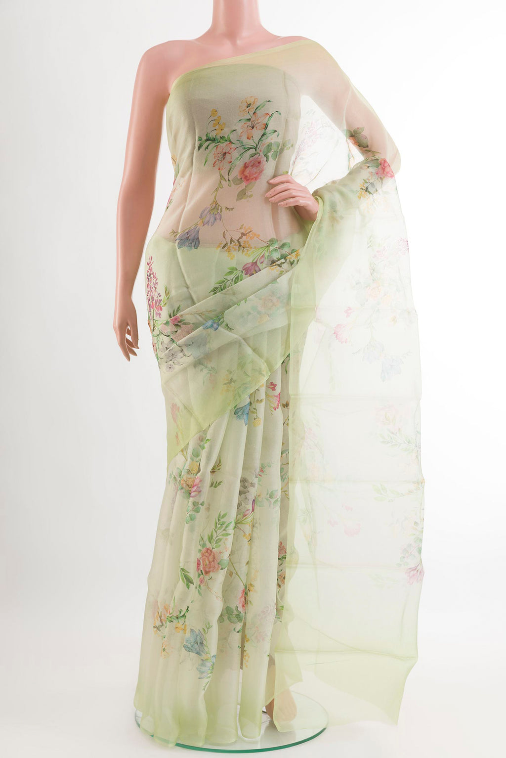 Green Organza Silk Saree with Printed design on the body and Plain Border.  displayed on a mannequin