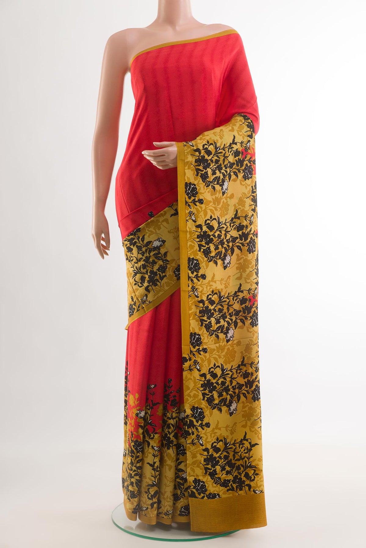 Red Mysore Crepe Saree with Printed design on the body and Printed Border.  displayed on a mannequin