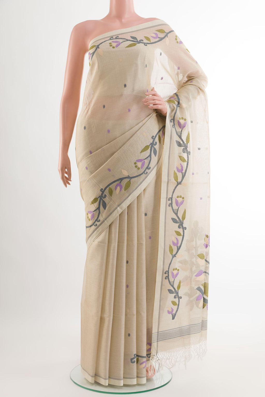 Cream Mul Cotton Saree with Embroidery on the body and Plain Border.  displayed on a mannequin