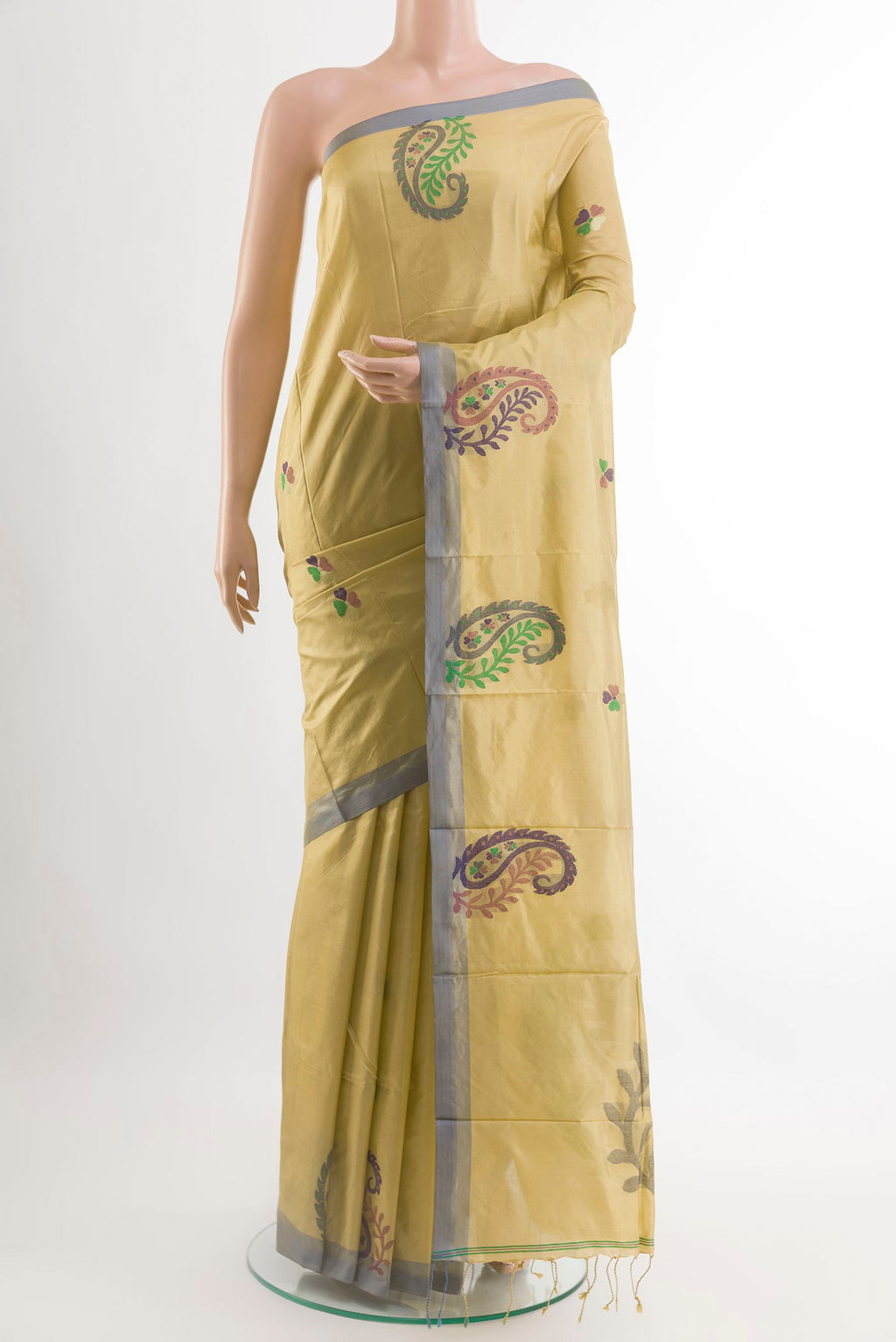 Beige Kanjivaram Silk Saree with Thread Butta on the body and Embroidery Border.  displayed on a mannequin