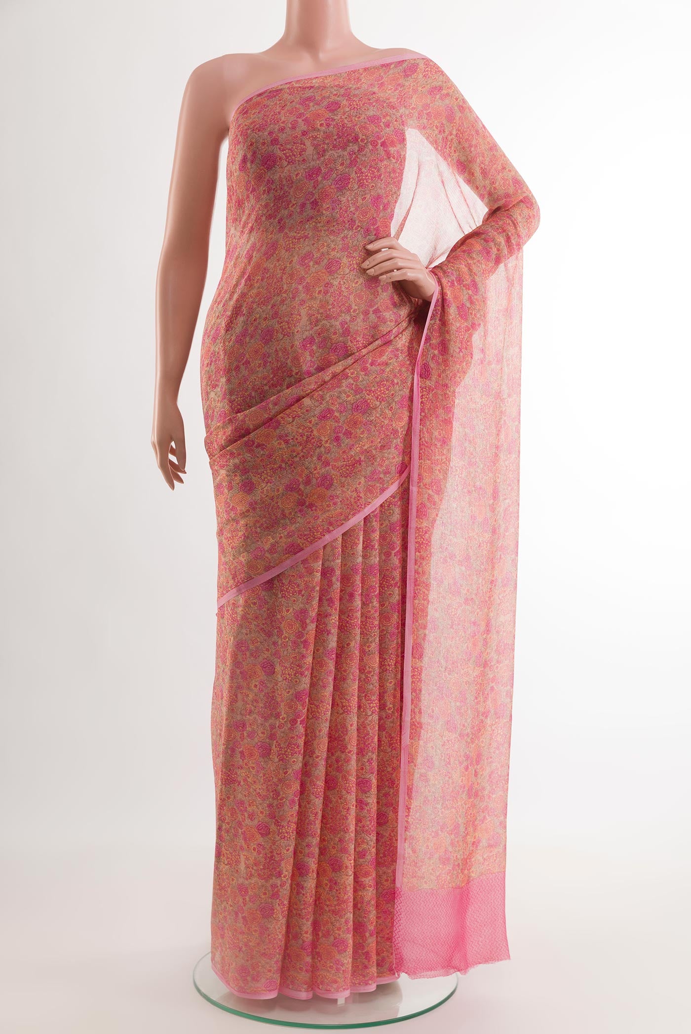 Beige Chiffon Saree with Printed design on the body and Plain Border.  displayed on a mannequin