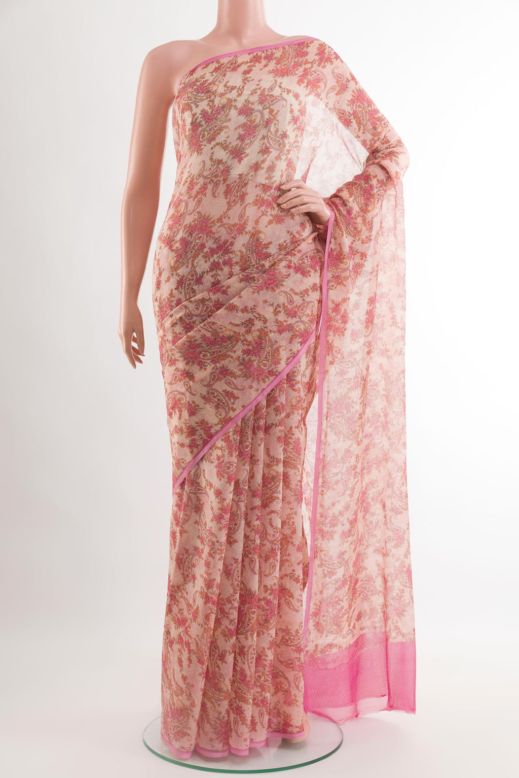 Off White Chiffon Saree with Printed design on the body and Plain Border.  displayed on a mannequin