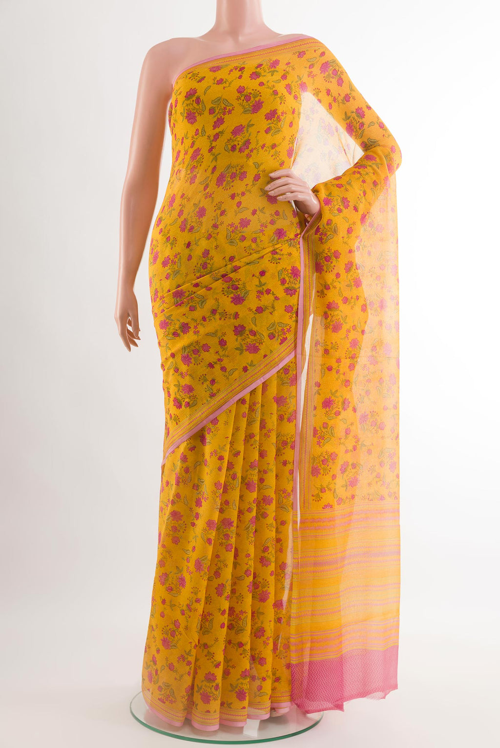 Yellow Chiffon Saree with Printed design on the body and Plain Border.  displayed on a mannequin