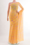 Yellow Mysore Chiffon Saree with Printed design on the body and Plain Border.  displayed on a mannequin