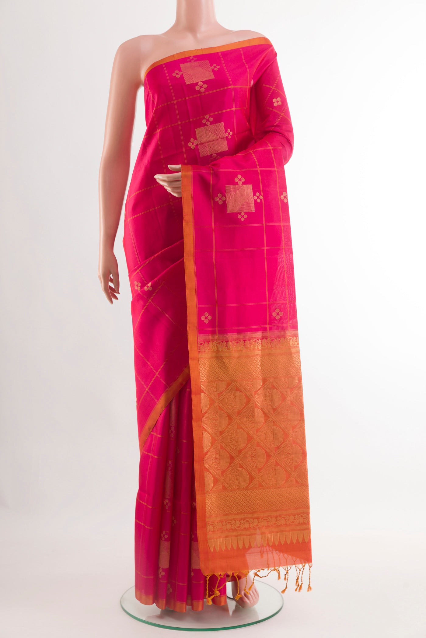 Pink Soft Silk Saree with Zari Butta on the body and Zari Border.  displayed on a mannequin