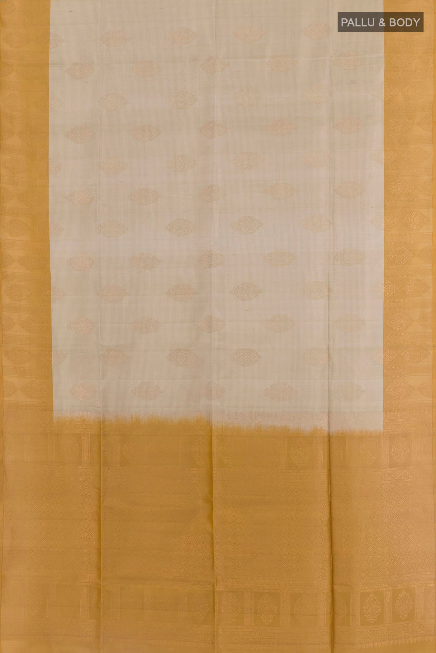 Flat view of Cream Soft Silk Saree with Zari Butta on the body and Zari Border. 