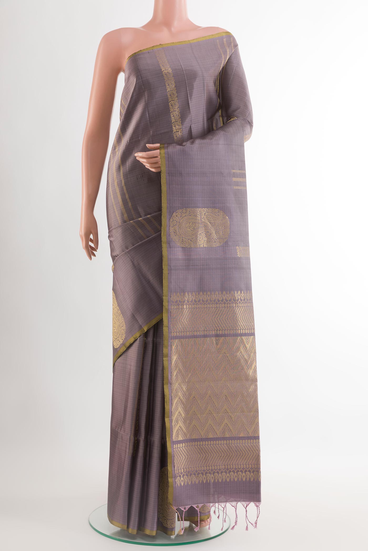 Lilac Soft Silk Saree with Stripes on the body and Zari Border.  displayed on a mannequin