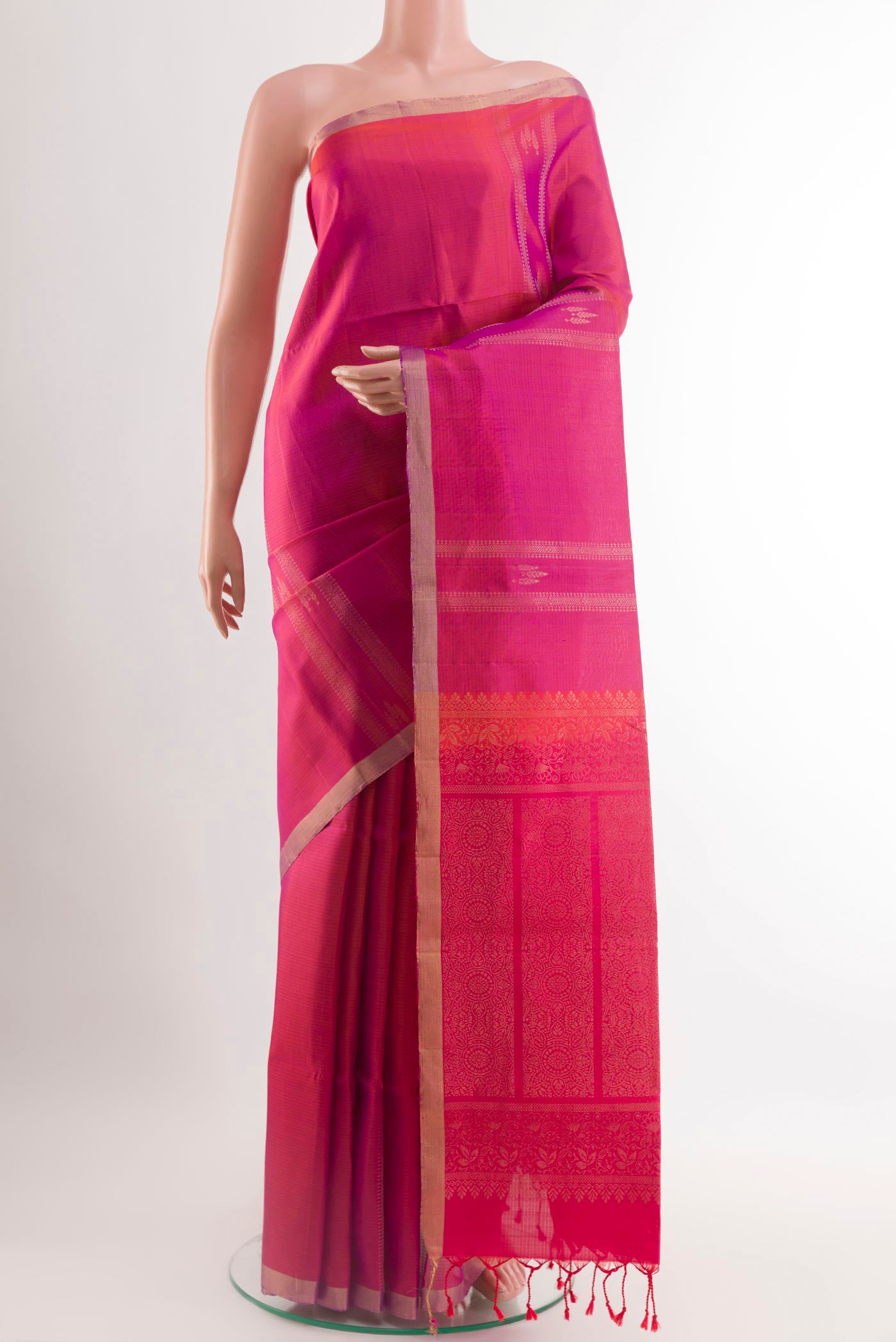 Pink Soft Silk Saree with Zari Butta on the body and Zari Border.  displayed on a mannequin
