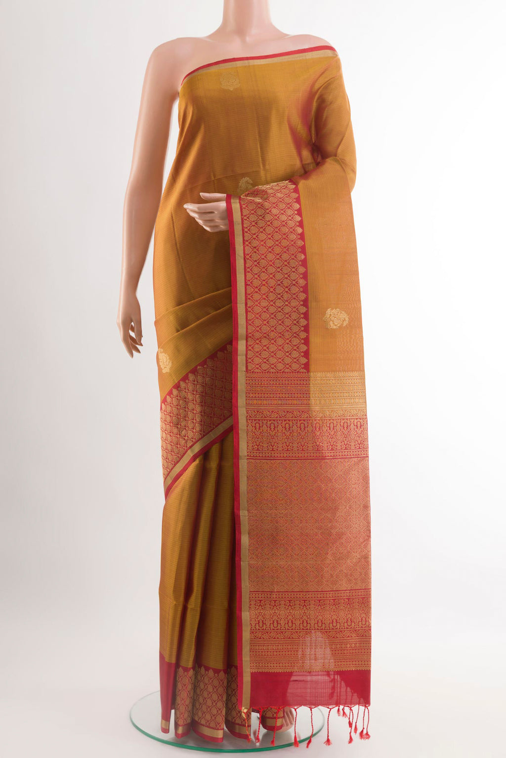 Mustard Soft Silk Saree with Stripes on the body and Zari Border.  displayed on a mannequin