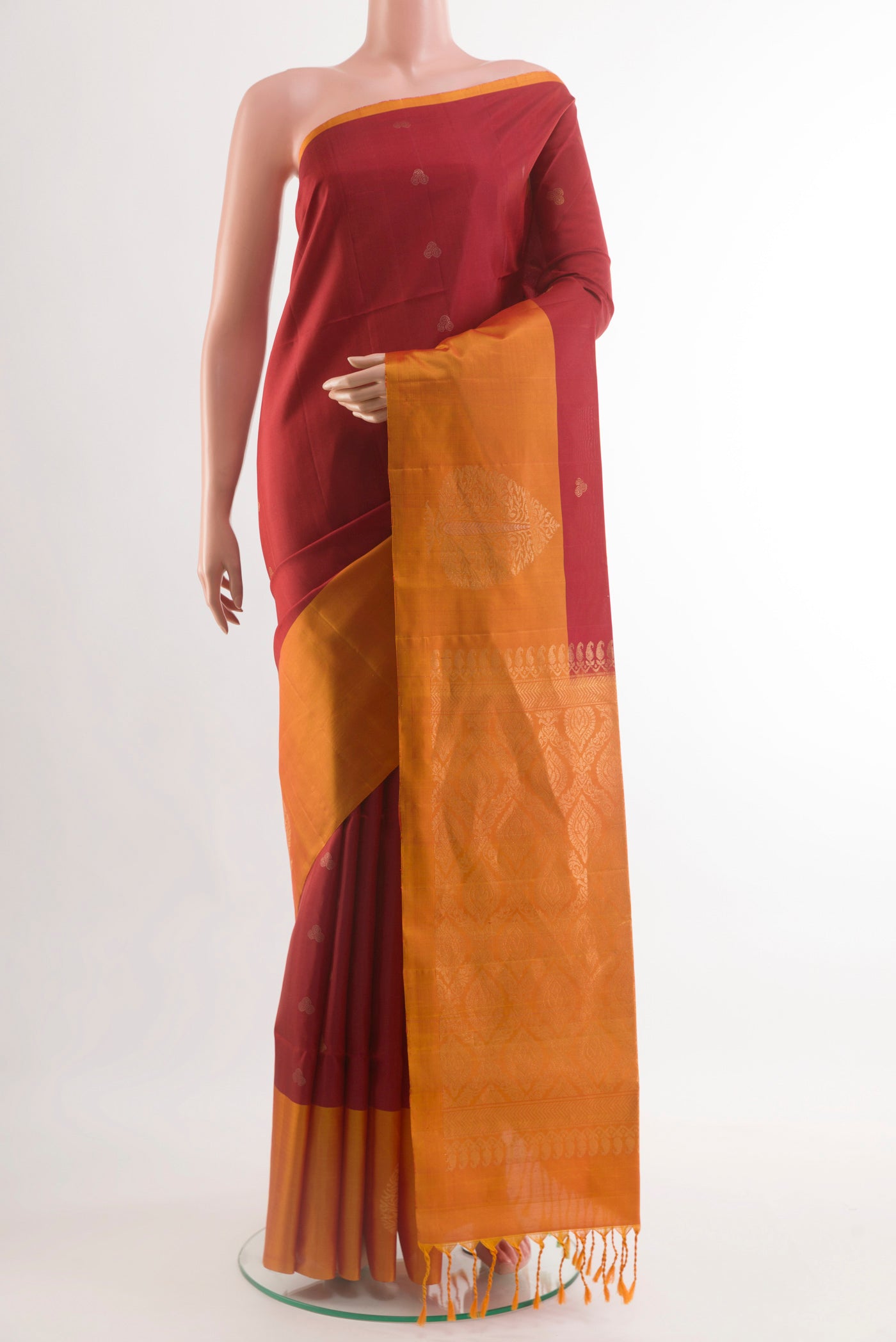 Red Soft Silk Saree with Zari Butta on the body and Zari Border.  displayed on a mannequin