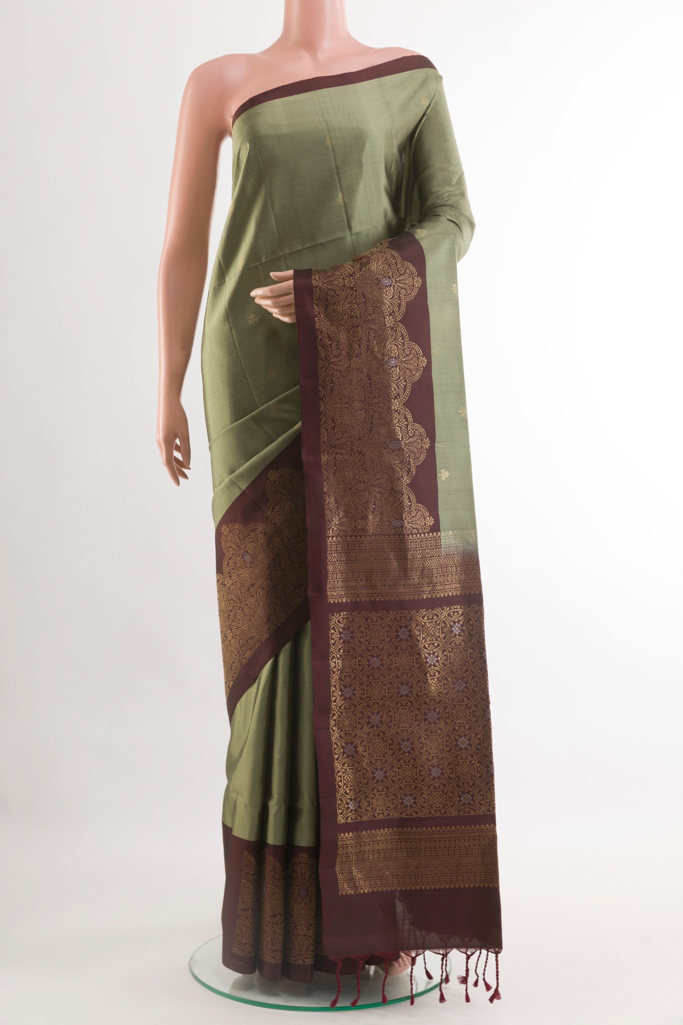 Grey Soft Silk Saree with Zari Butta on the body and Zari Border.  displayed on a mannequin