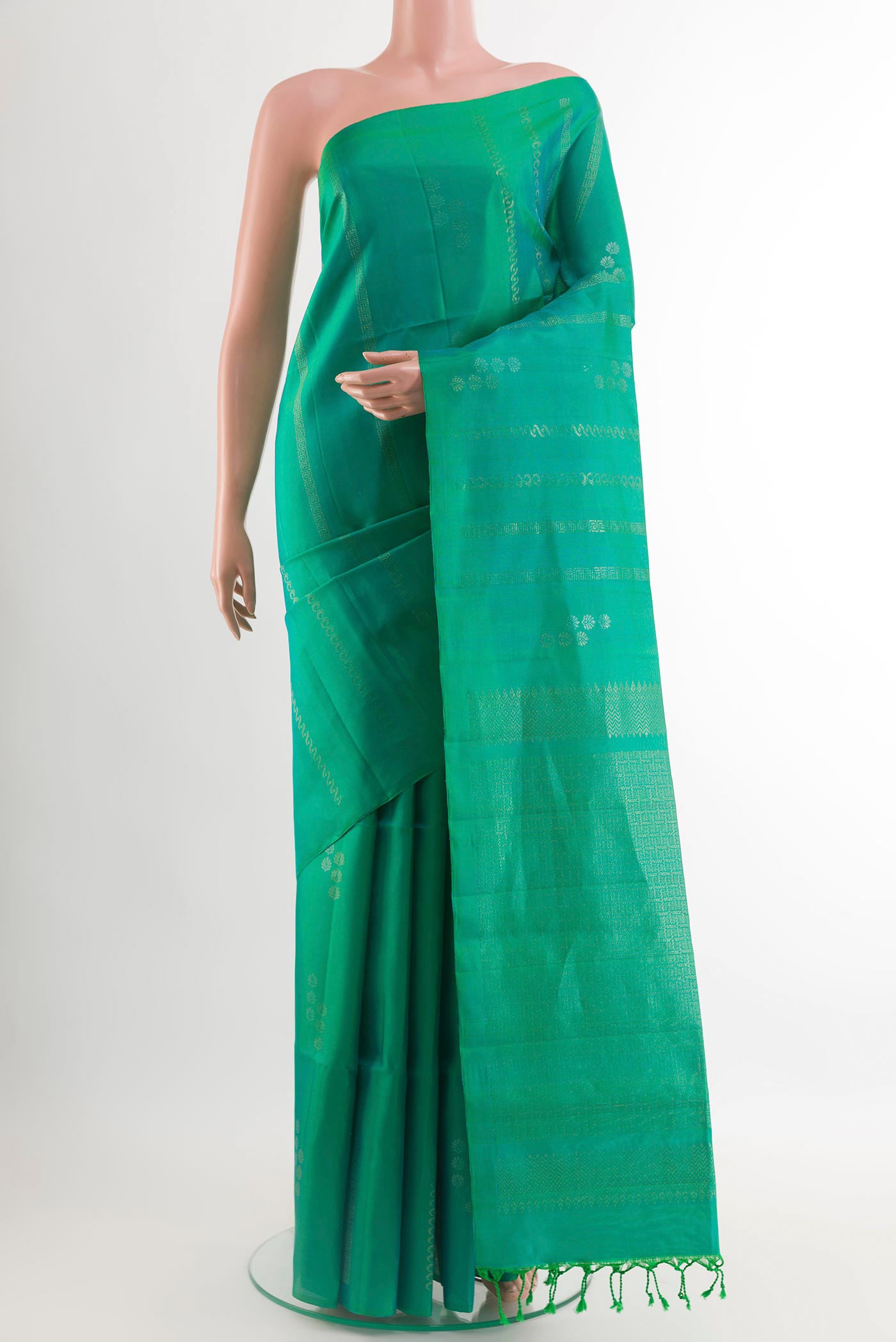 Sea Green Soft Silk Saree with Zari Butta on the body and Zari Border.  displayed on a mannequin