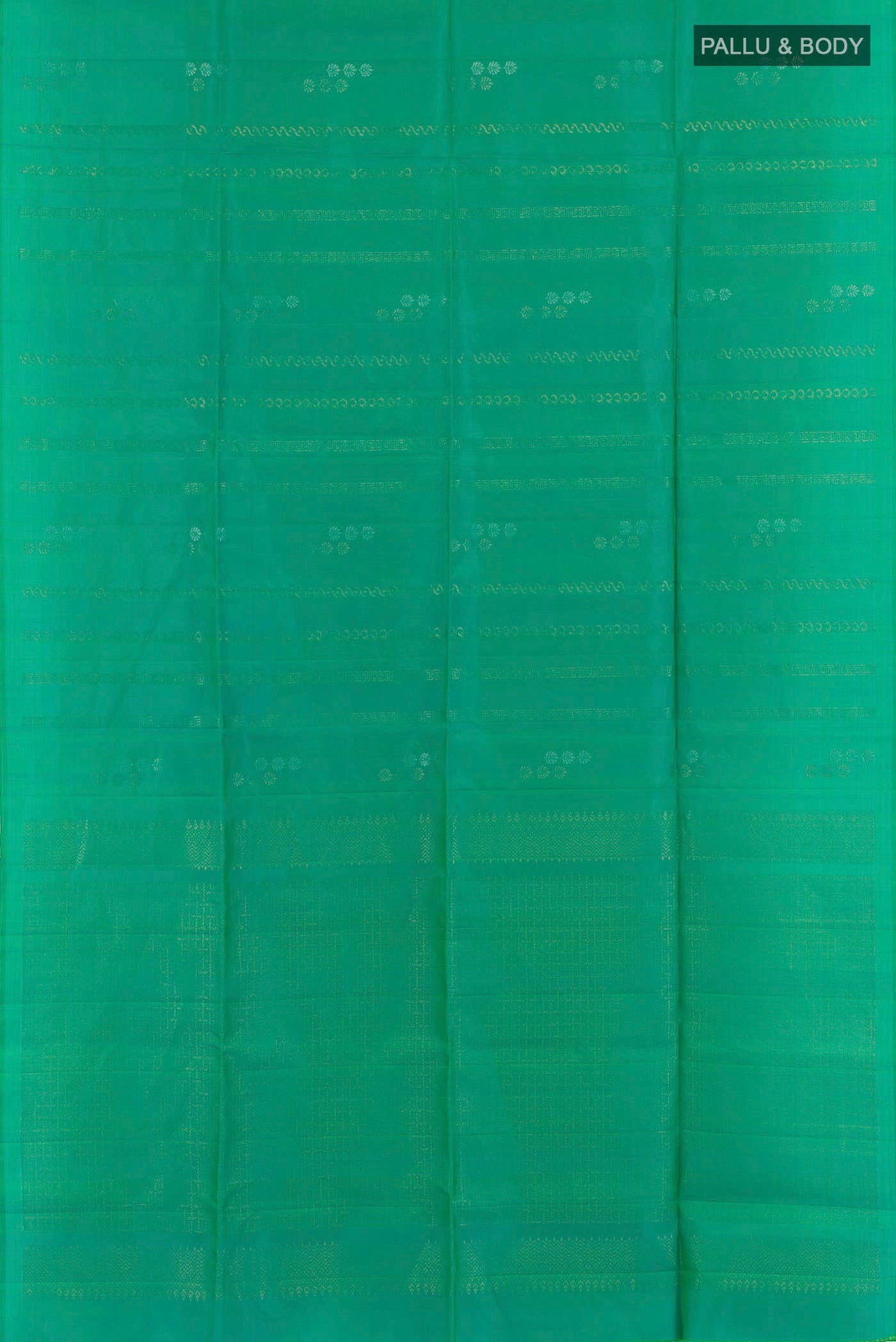 Flat view of Sea Green Soft Silk Saree with Zari Butta on the body and Zari Border. 