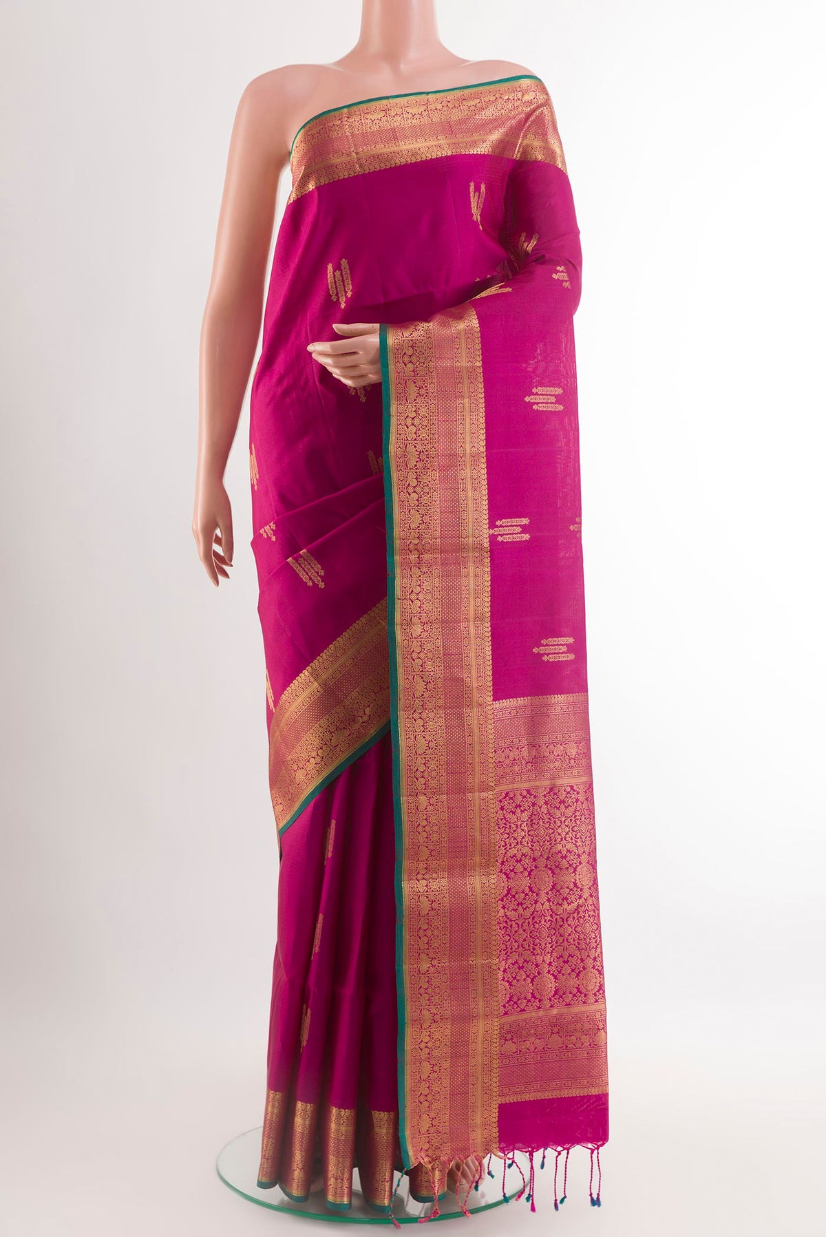 Purple Soft Silk Saree with Zari Butta on the body and Zari Border.  displayed on a mannequin