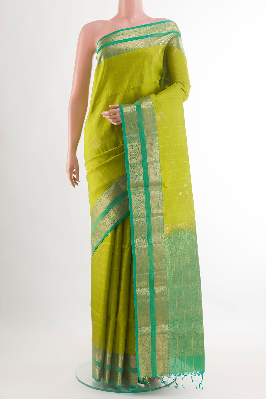 Light Green Soft Silk Saree with Zari Butta on the body and Zari Border.  displayed on a mannequin