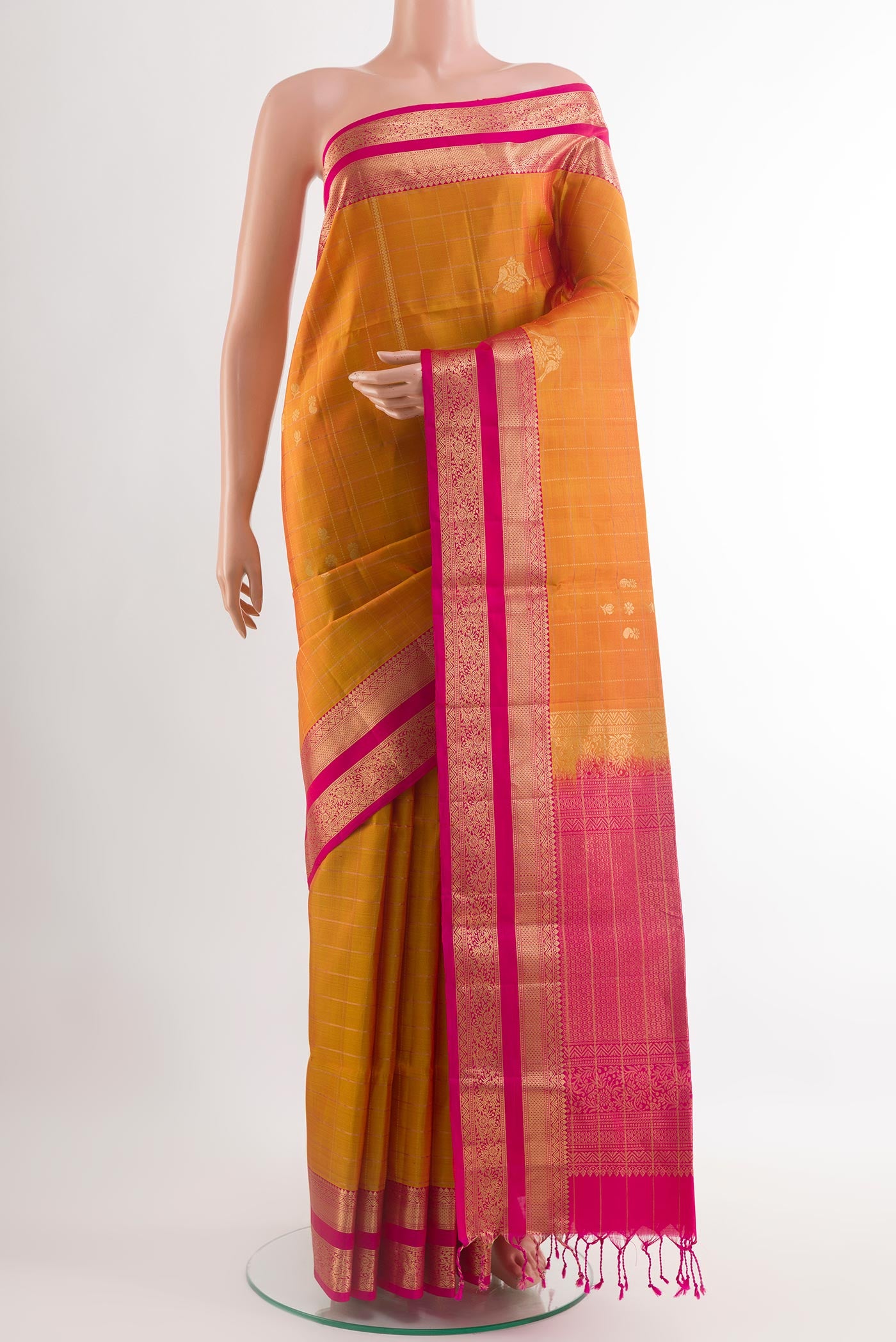 Yellow Soft Silk Saree with Stripes on the body and Zari Border.  displayed on a mannequin