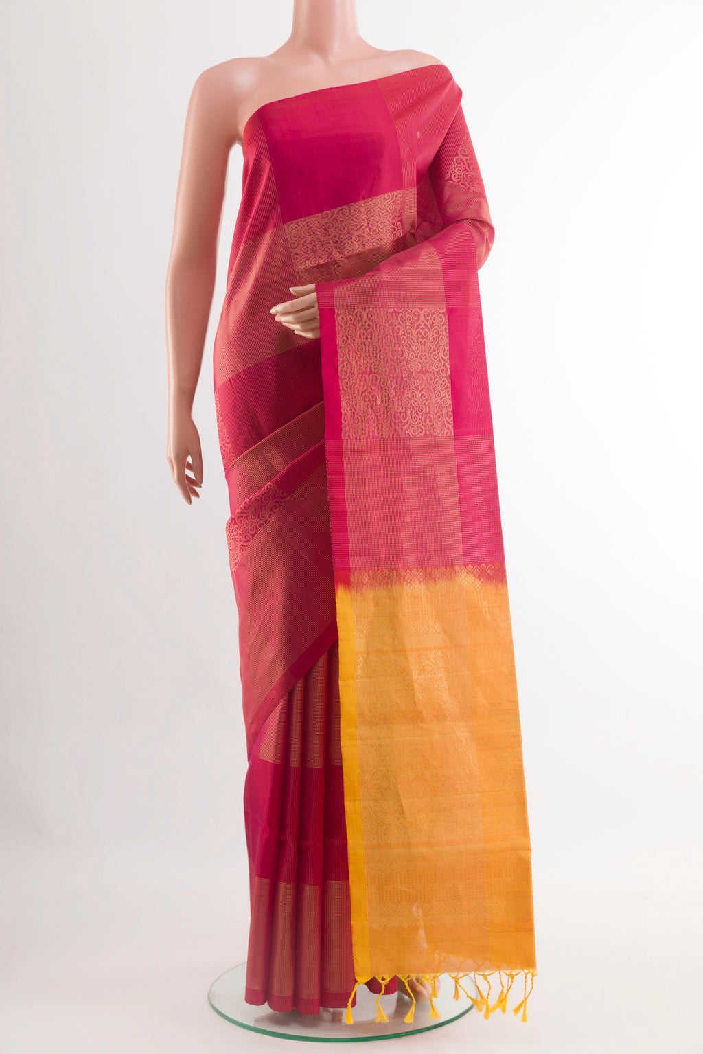 Maroon Soft Silk Saree with Zari Butta on the body and Zari Border.  displayed on a mannequin
