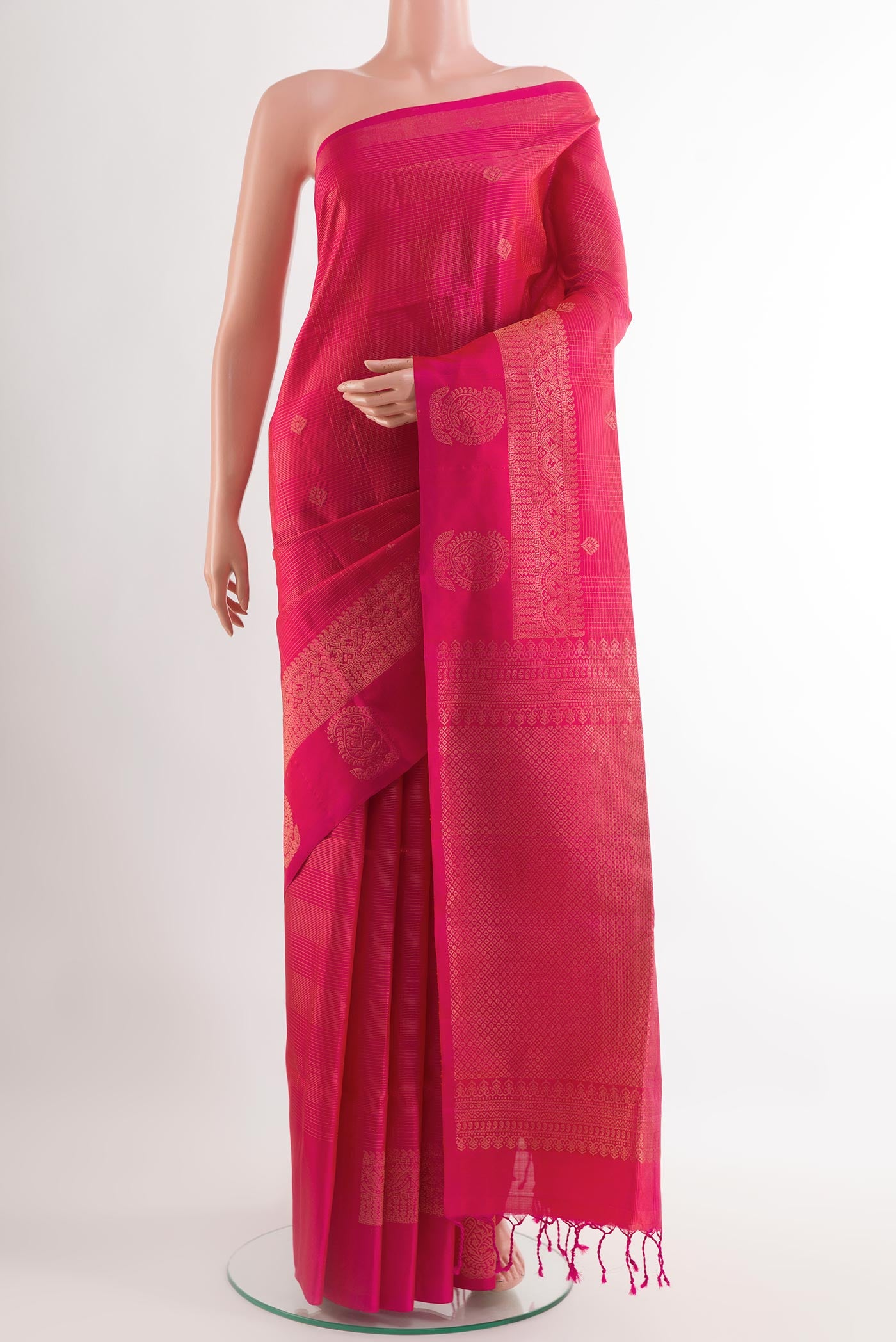 Pink Soft Silk Saree with Stripes on the body and Zari Border.  displayed on a mannequin
