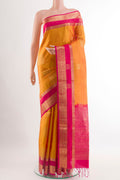 Yellow Soft Silk Saree with Zari Butta on the body and Zari Border.  displayed on a mannequin