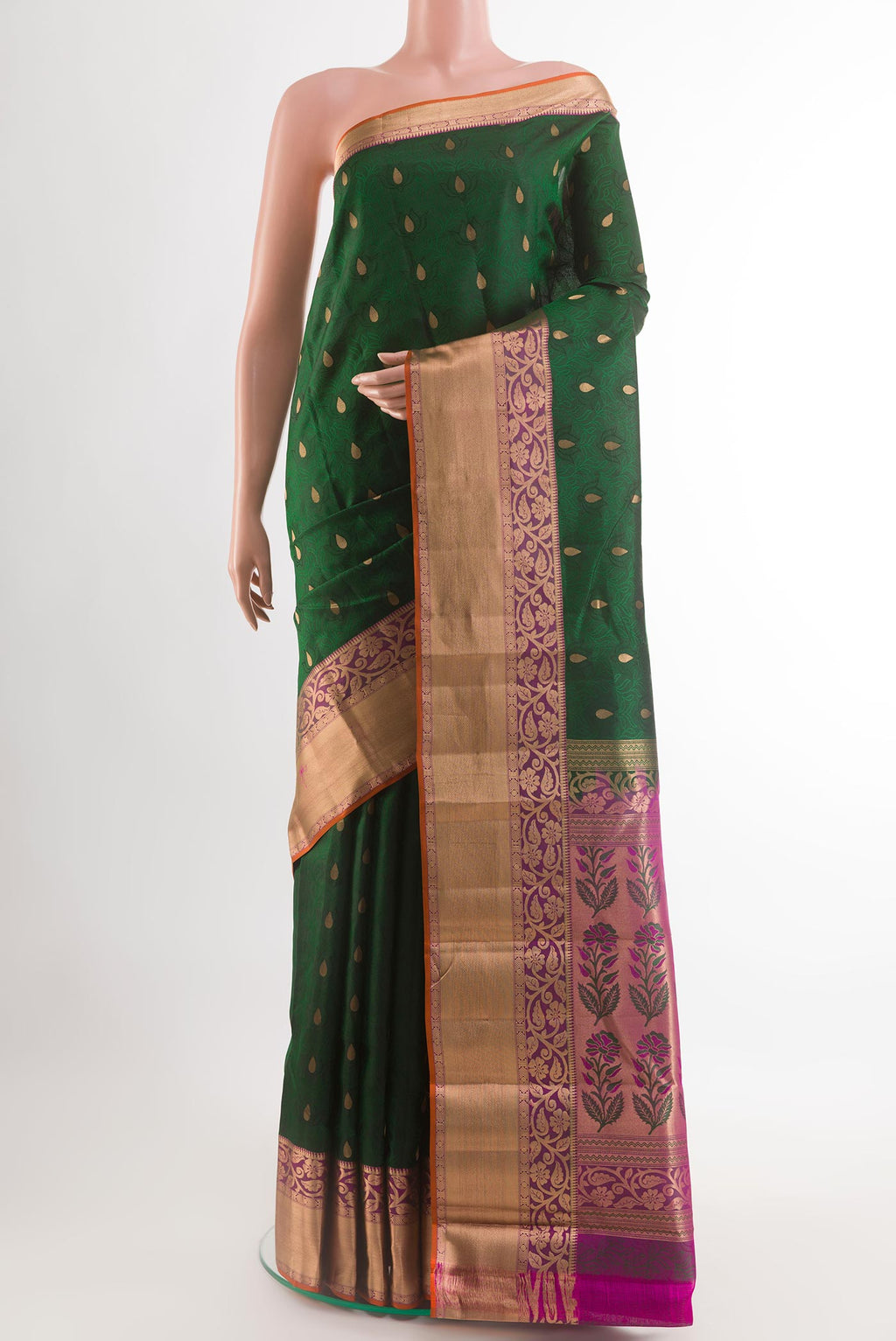 Bottle Green Kanchipuram Silk Saree with Jacquard With Zari Butta on the body and Zari Border.  displayed on a mannequin