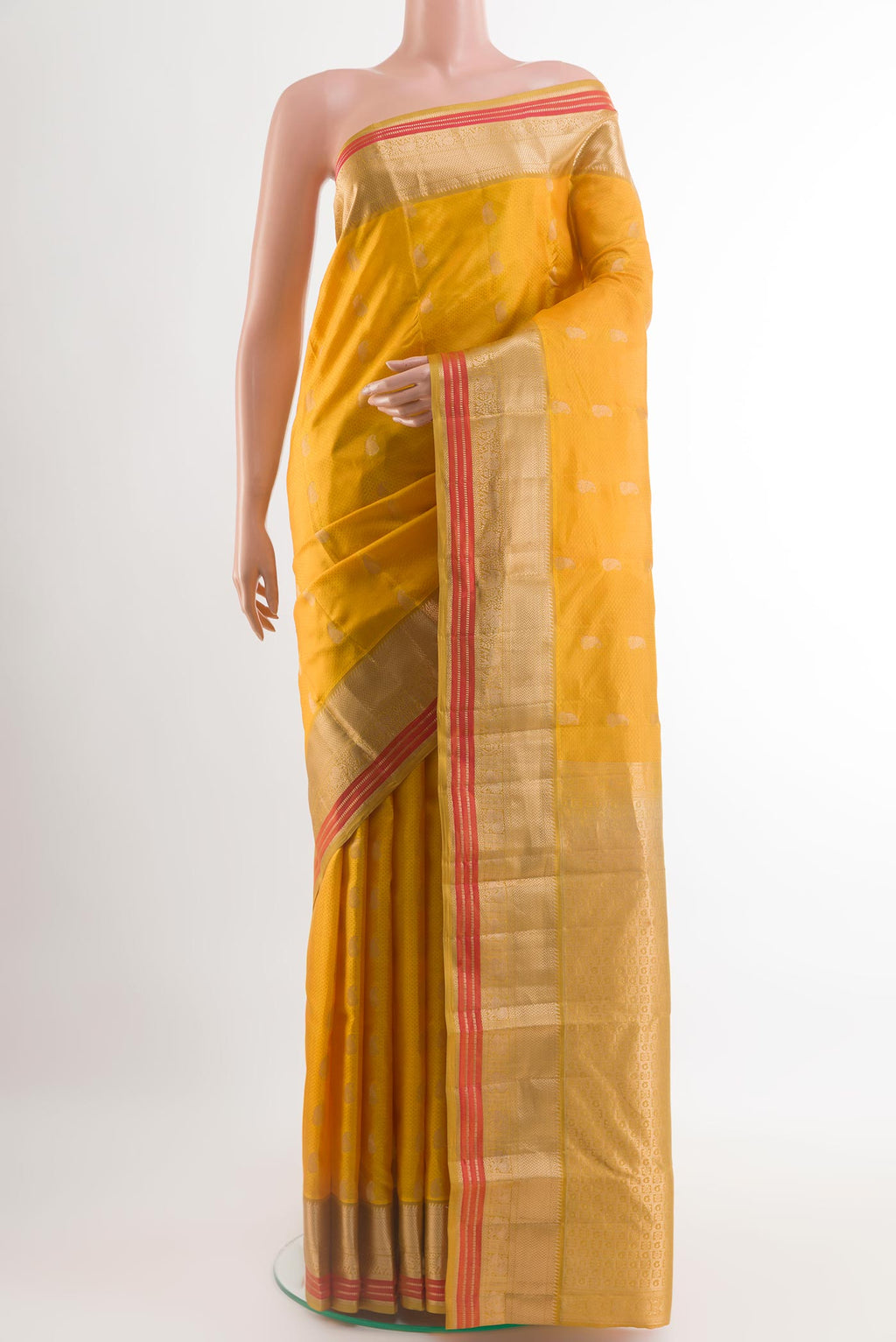 Yellow Kanchipuram Silk Saree with Jacquard With Zari Butta on the body and Zari Border.  displayed on a mannequin