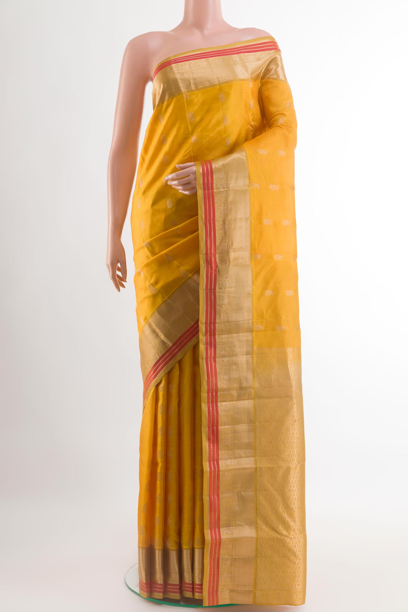 Yellow Kanchipuram Silk Saree with Jacquard With Zari Butta on the body and Zari Border.  displayed on a mannequin