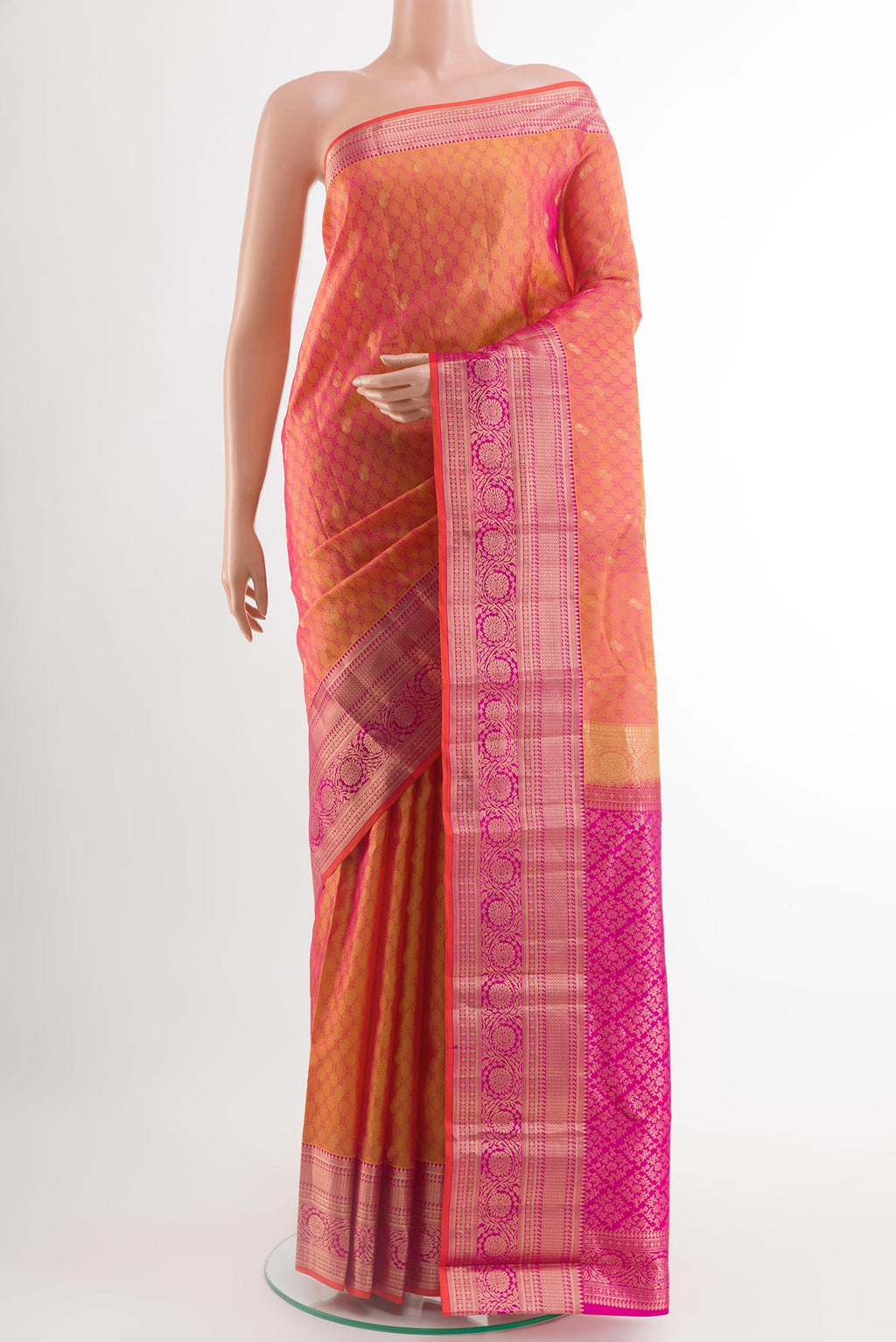 Peach Kanchipuram Silk Saree with Jacquard With Zari Butta on the body and Zari Border.  displayed on a mannequin