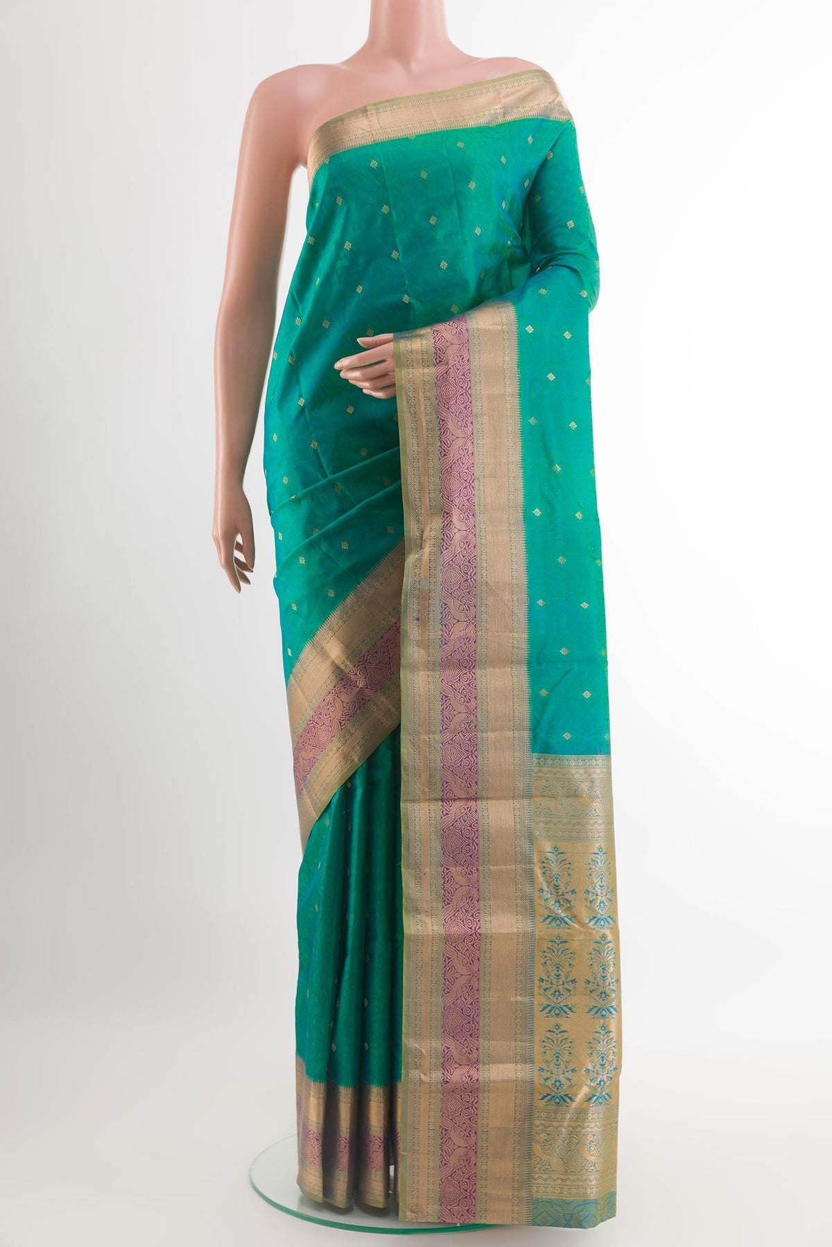 Green Kanchipuram Silk Saree with Jacquard With Zari Butta on the body and Zari Border.  displayed on a mannequin