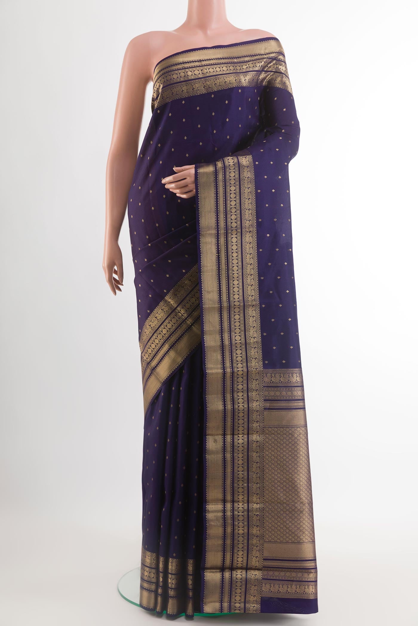 Blue Kanchipuram Silk Saree with Zari Butta on the body and Zari Border.  displayed on a mannequin