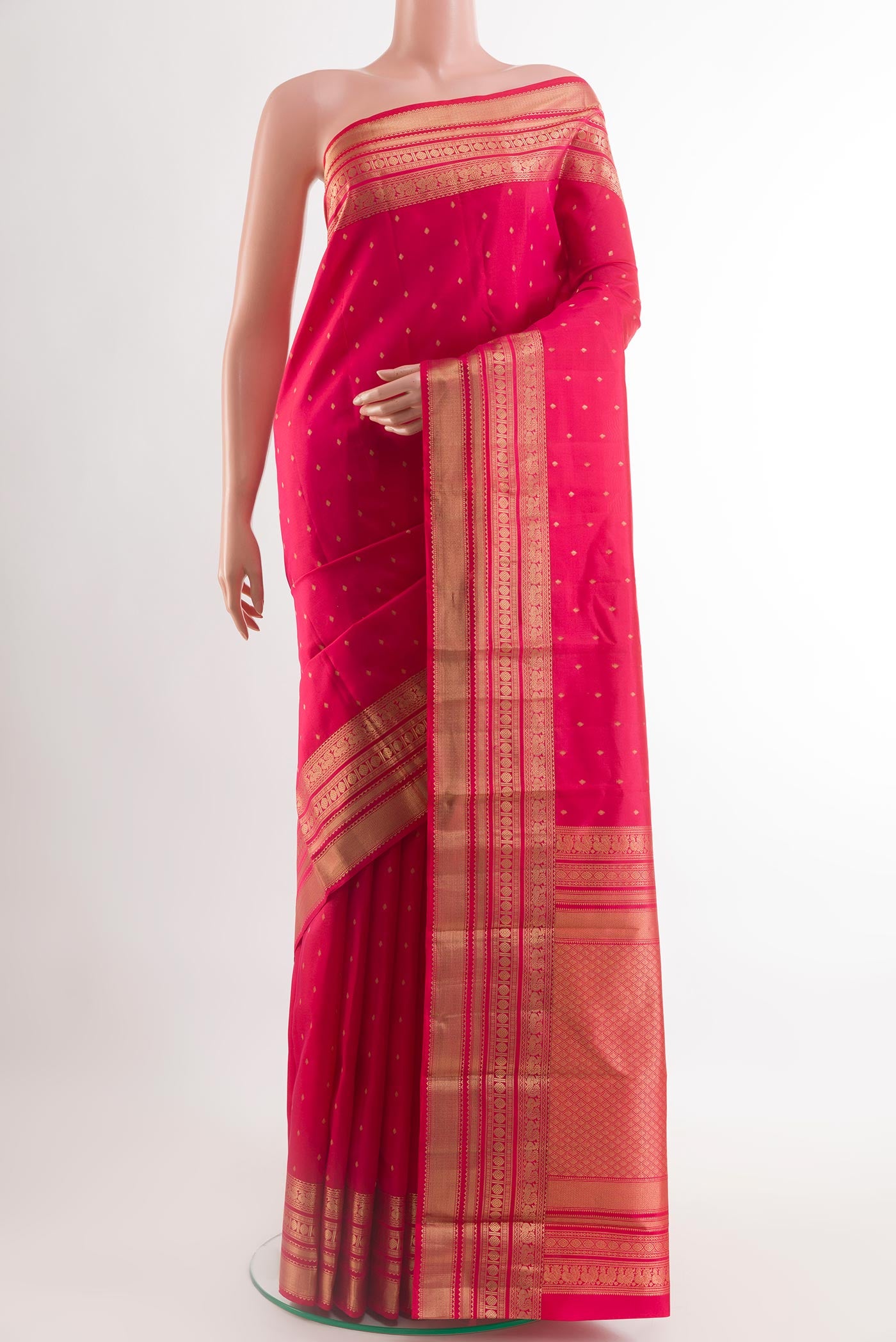 Red Kanchipuram Silk Saree with Zari Butta on the body and Zari Border.  displayed on a mannequin