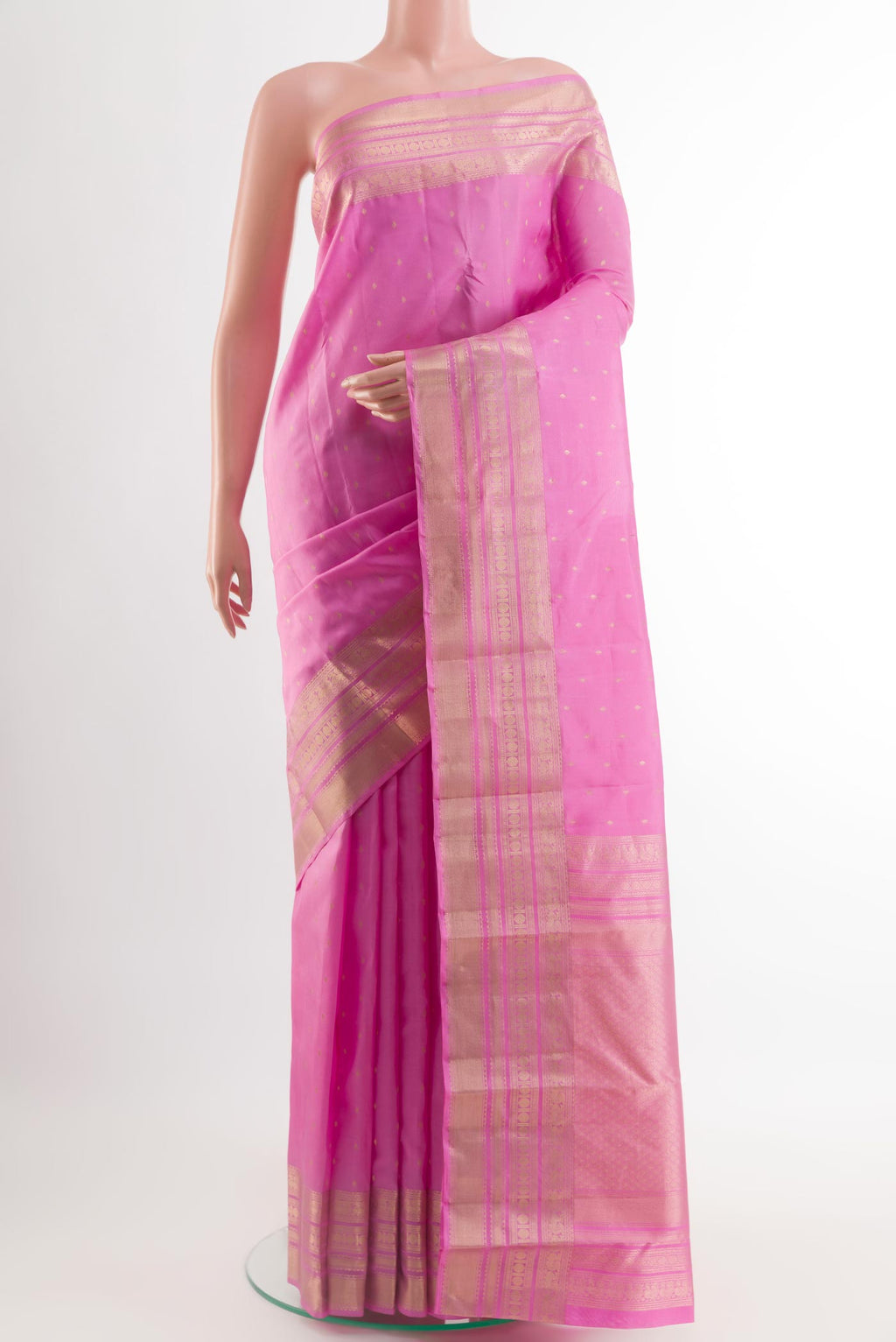 Pink Kanchipuram Silk Saree with Zari Butta on the body and Zari Border.  displayed on a mannequin