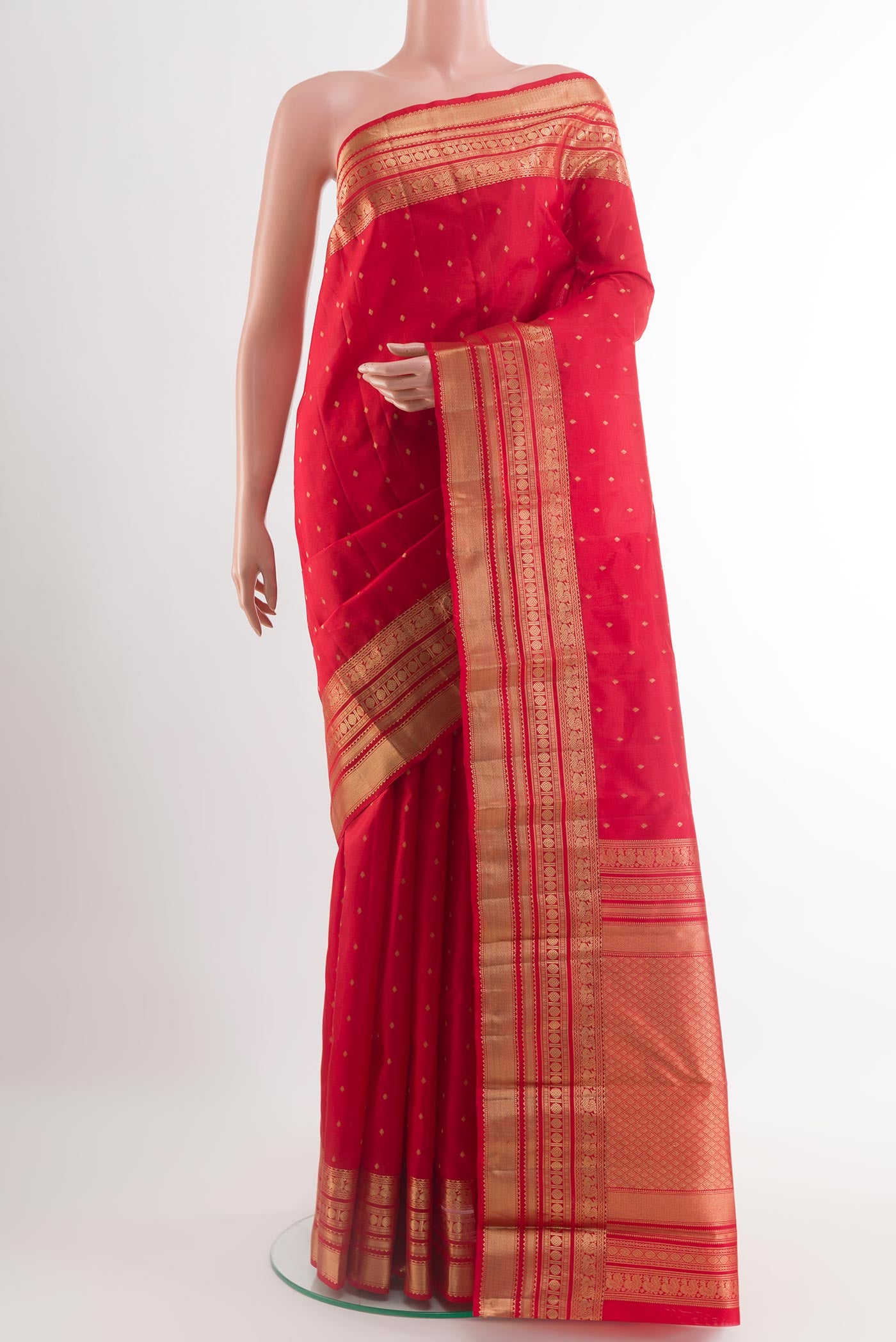 Red Kanchipuram Silk Saree with Zari Butta on the body and Zari Border.  displayed on a mannequin
